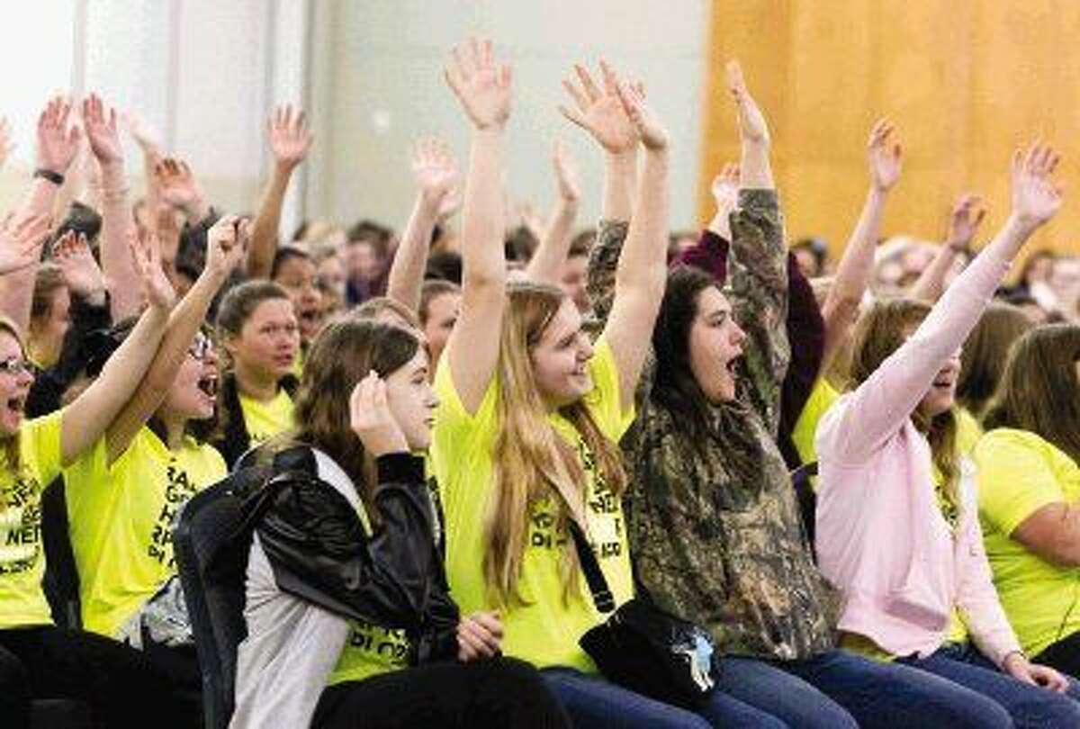 Magnolia students cheer during the opening presentation of the Girls Engineering Festival at Lone Star Convention Center Tuesday. More than 500 eighth grade girls took part in the annual festival, which focused on introducing girls to various aspects and careers in engineering. Go to HCNpics.com to view more photos from the event.