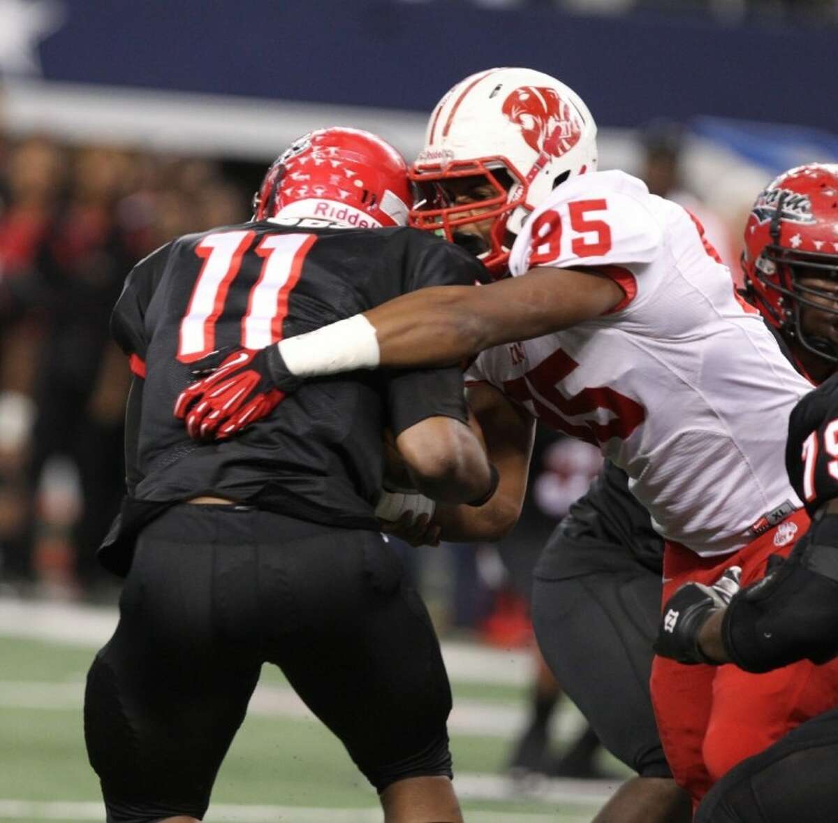 Katy defensive lineman Tim Wilkerson sacks Cedar Hill quarterback Damion Hobbs during the Tigers' 35-24 victory in the state final Dec. 22 at Cowboys Stadium in Arlington.