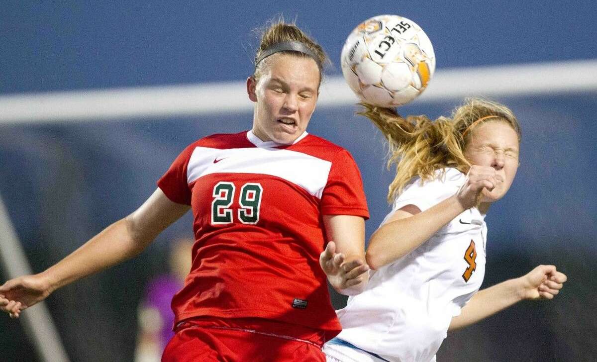 The Woodlands’ Grace Piper goes for a header against Round Rock Westwood’s Hannah Col during a Region II-6A area soccer game in Brenham Thursday. Round Rock Westwood defeated The Woodlands 4-2 in penalty kicks. To view or purchase this photo and others like it, visit HCNpics.com.