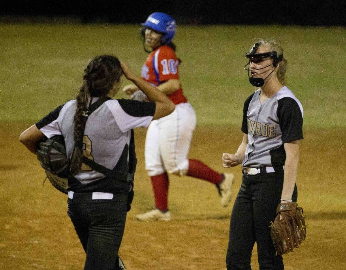 Conroe catcher Maycie Walton talks to pitcher Madelyn Tannery, right, after walking in a run in the third inning of a District 16-6A softball game at Conroe High School Tuesday. Go to HCNpics.com to purchase this photos, and other like it.