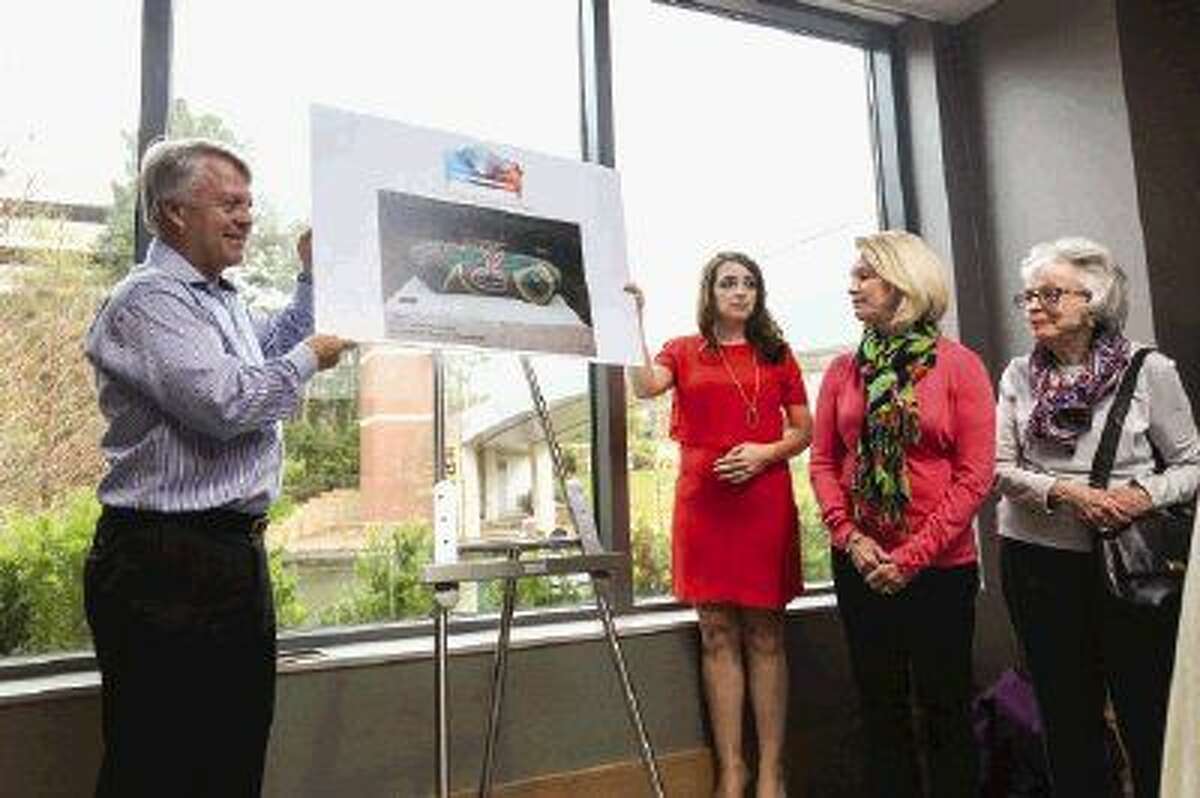 The Woodlands Art Council Board member and Art Bench Committee Chair Theresa Terrell helps unveil art bench “Bean” while recognizing underwriters Gayle and Todd Kuoni during the TWAC Bench Unveiling Ceremony March 8 at the The Westin-The Woodlands. To view more photos from the event, go to HCNPics.com.