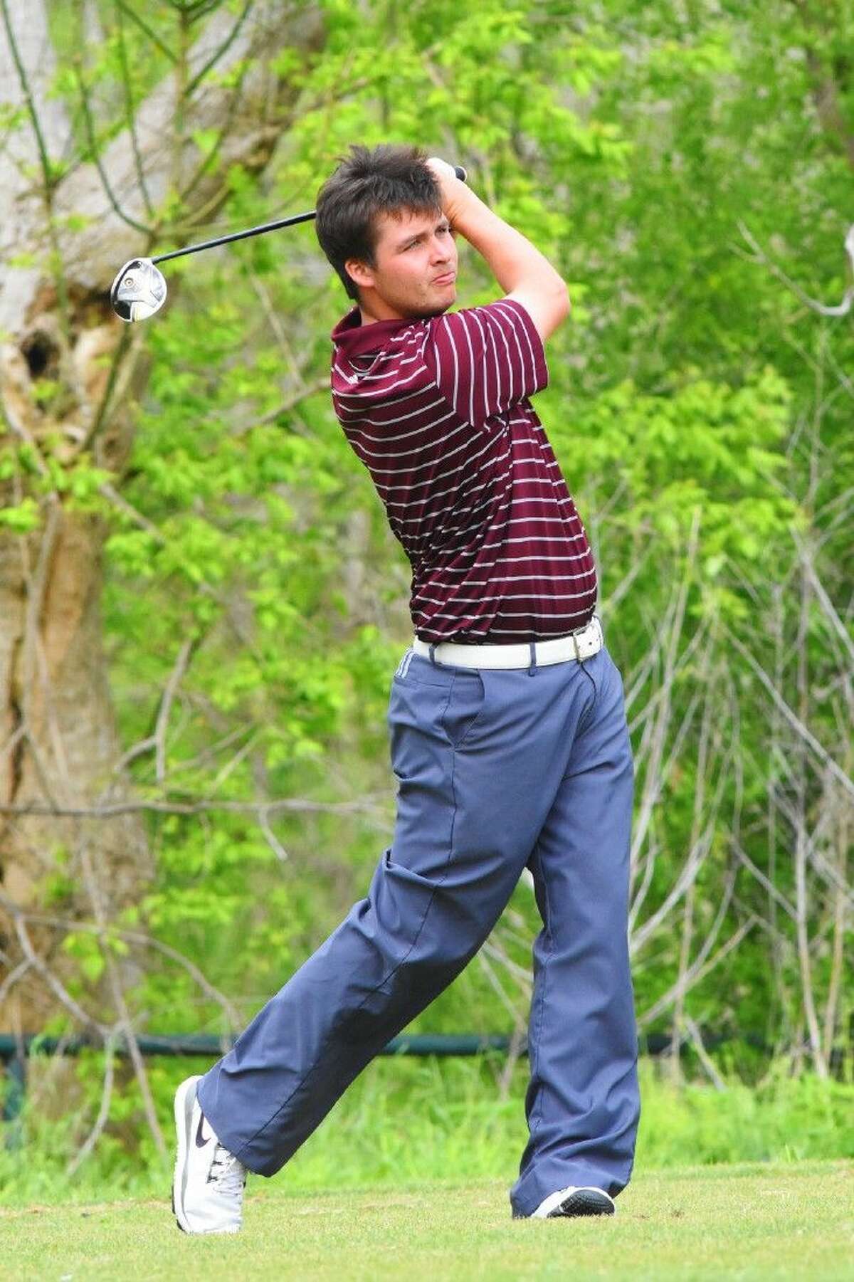 Magnolia’s Ryan Burke tees off during the District 19-5A championship River Ridge Golf Course.