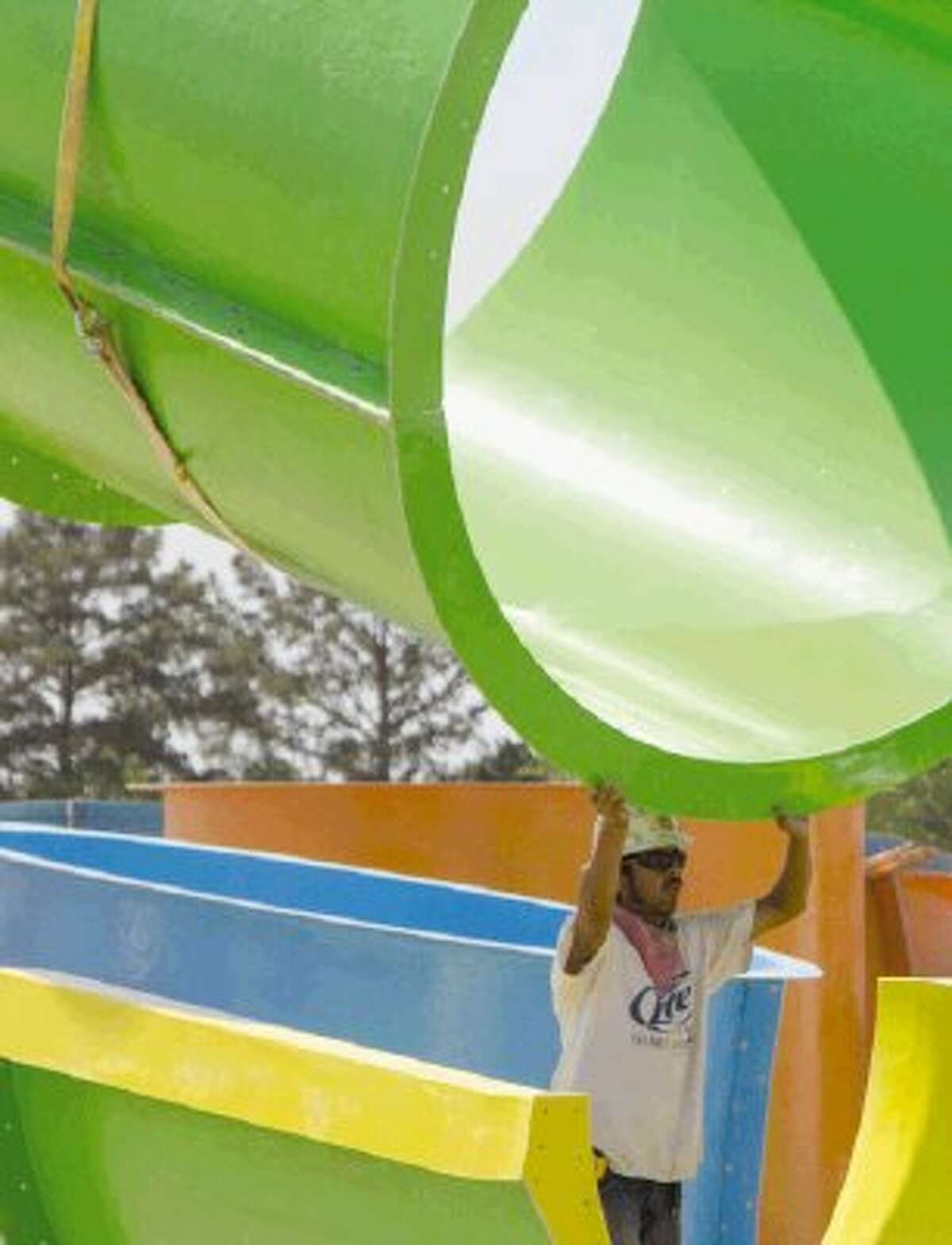 Construction crews work on putting together the Big Kahuna, a new water slide, at Wet ‘n’ Wild SplashTown in Spring Monday. The water park recently went through a multi-million dollar makeover and will have an unveiling Friday.