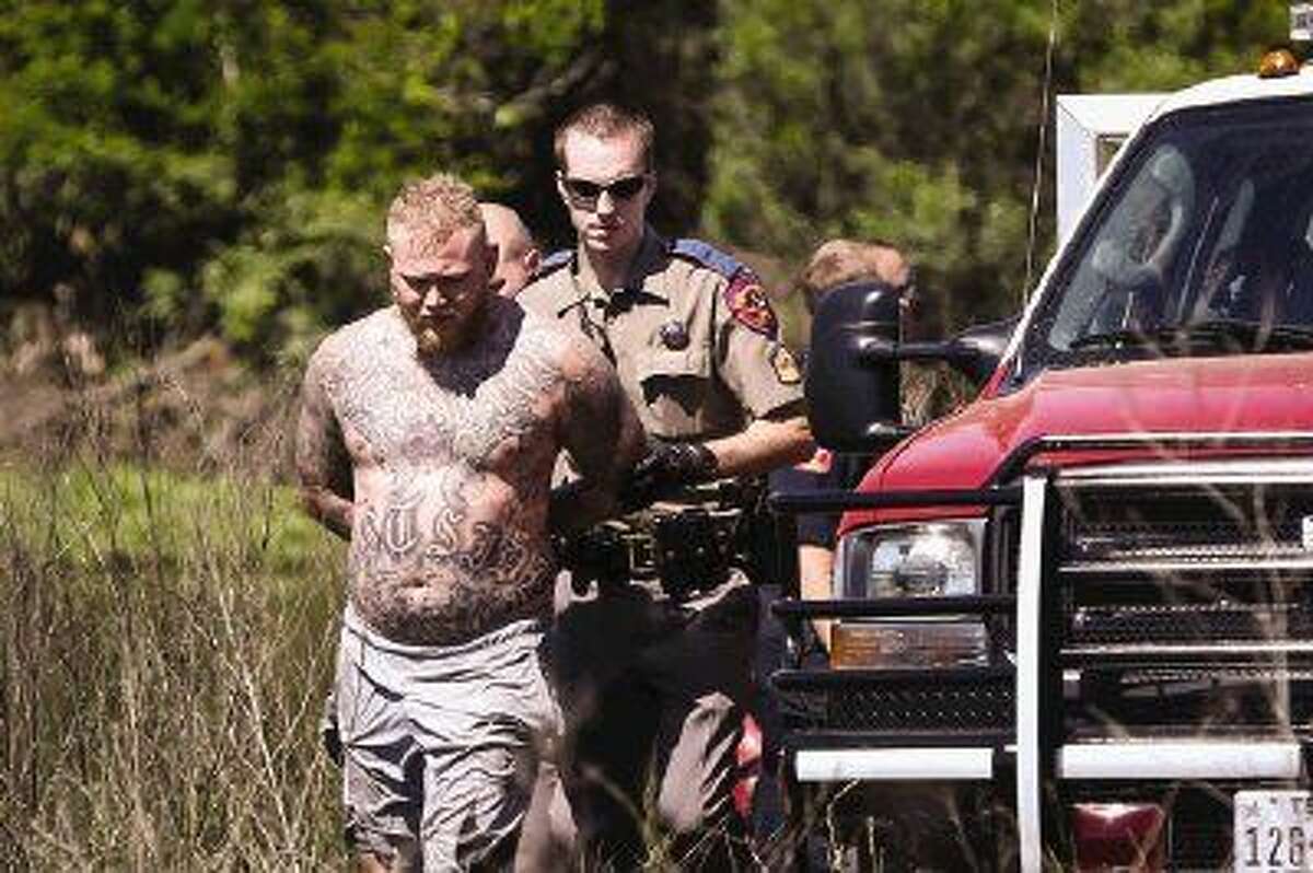 Emergency responders capture a man who allegedly fled from police to an island Monday off of Interstate 45 Southbound between River Plantation Drive and FM 1488.
