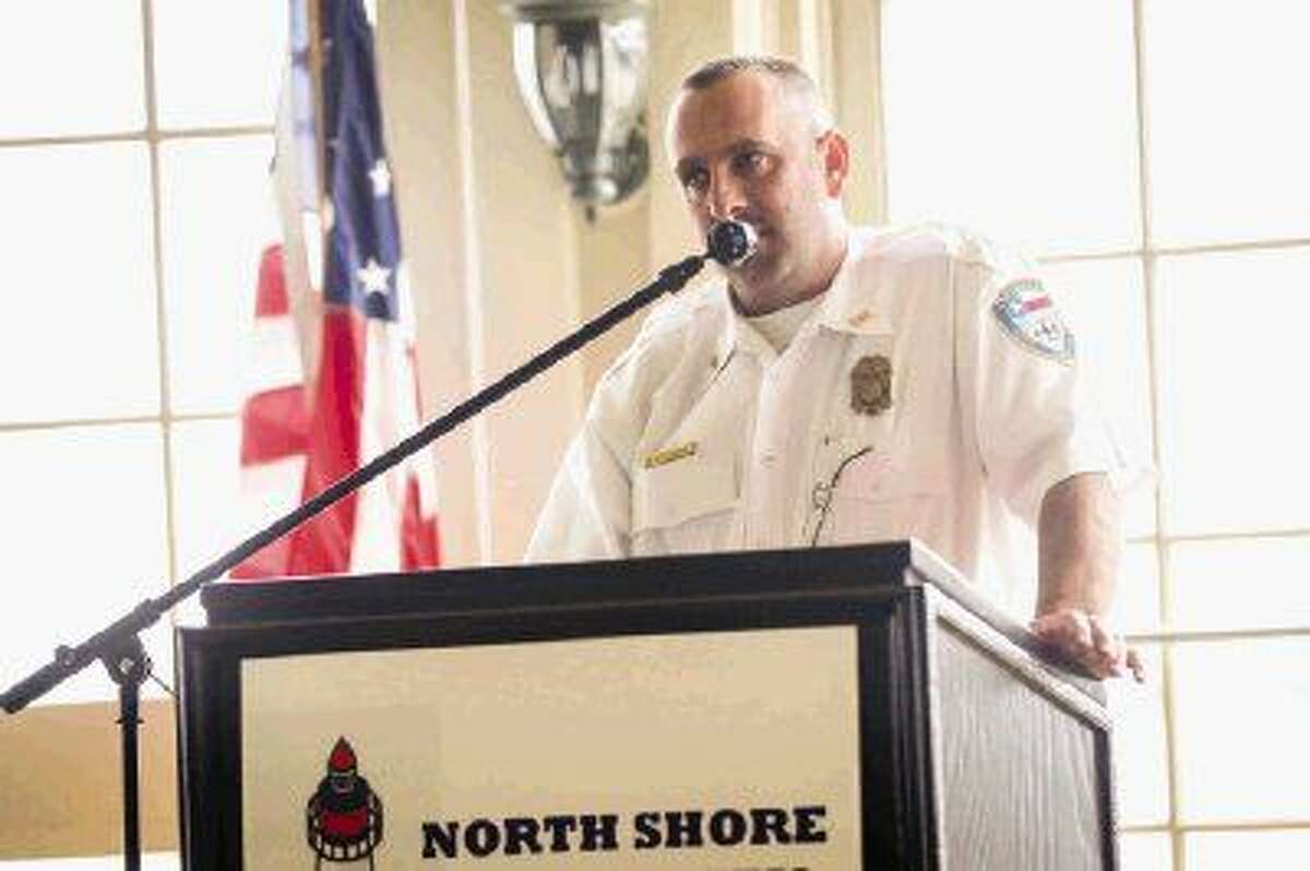 Brian Edwards, Montgomery Fire Chief, speaks at the Northshore Republican Women meeting about the district's sales tax proposal on Wednesday at Bentwater Yacht Club.