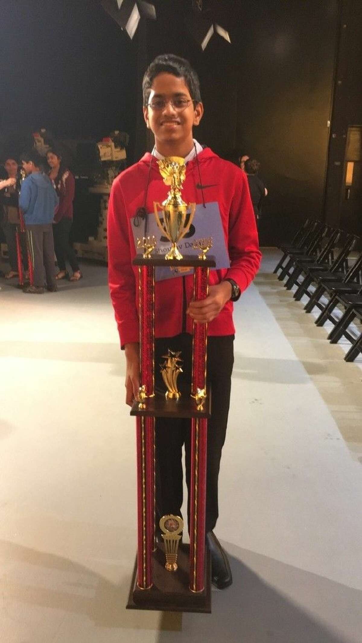 Shourav Dasari, a McCullough Junior High seventh-grader, poses with his trophy after winning the 2016 Houston Public Media Spelling Bee - the second largest in the nation.