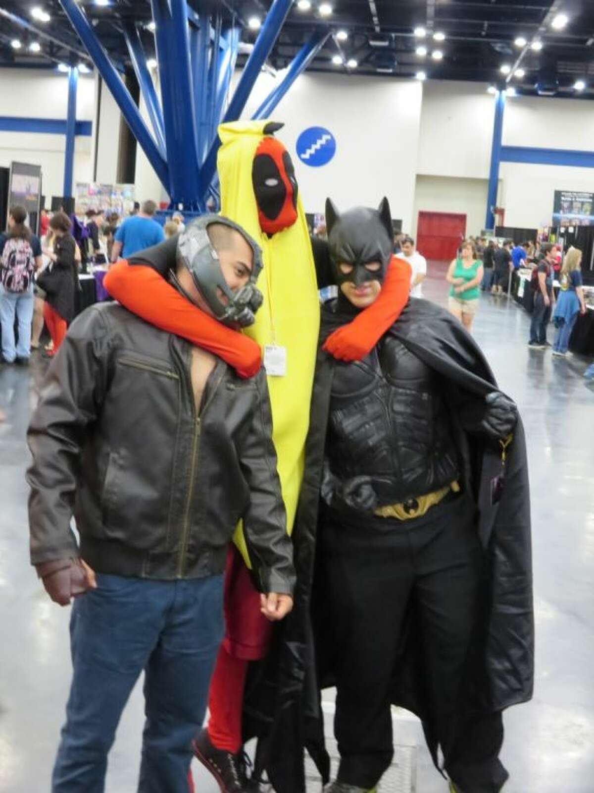 Cosplayers dressed as “Bananapool,” Bane and Batman pose for pictures at Comicpalooza 2014 at the George R Brown Convention Center Memorial Day weekend.