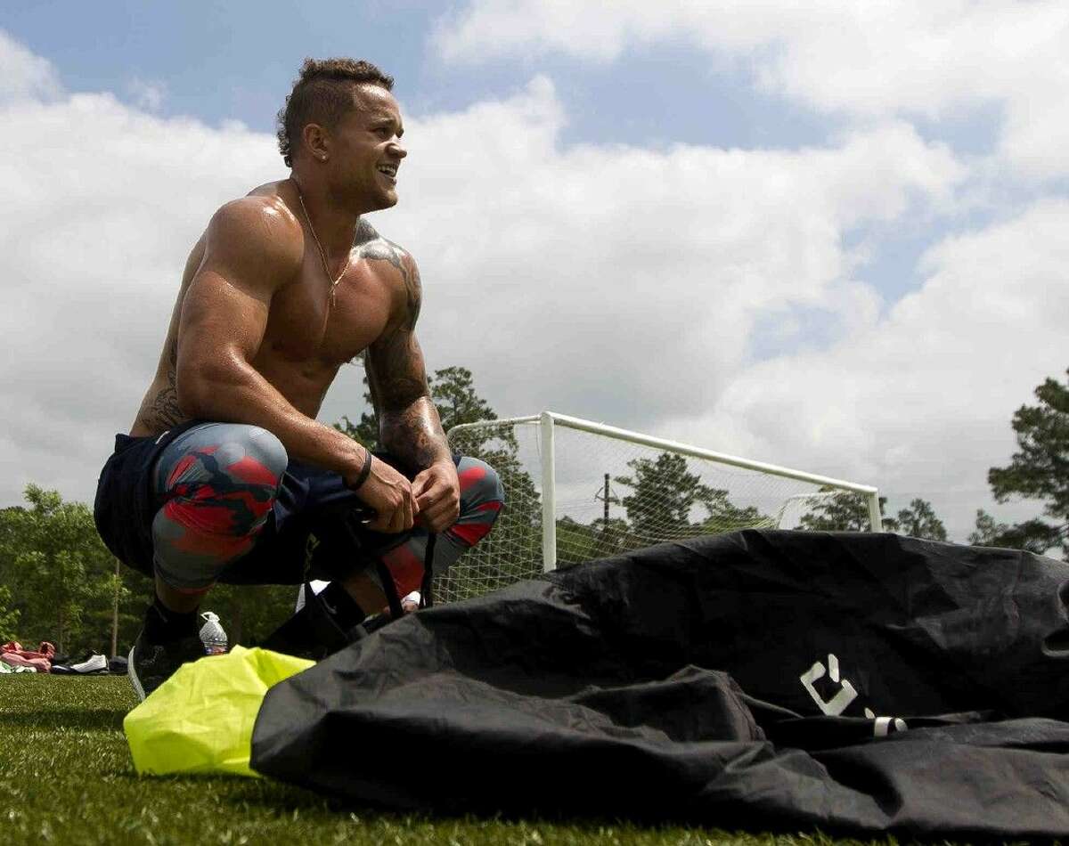 Daniel Lasco, former football player for The Woodlands and NFL hopeful, takes a break between workout sets at Bear Branch Sports Complex in The Woodlands Tuesday. The former high school All-American and California running back looks to break into the NFL after taking part in the NFL scouting combine.