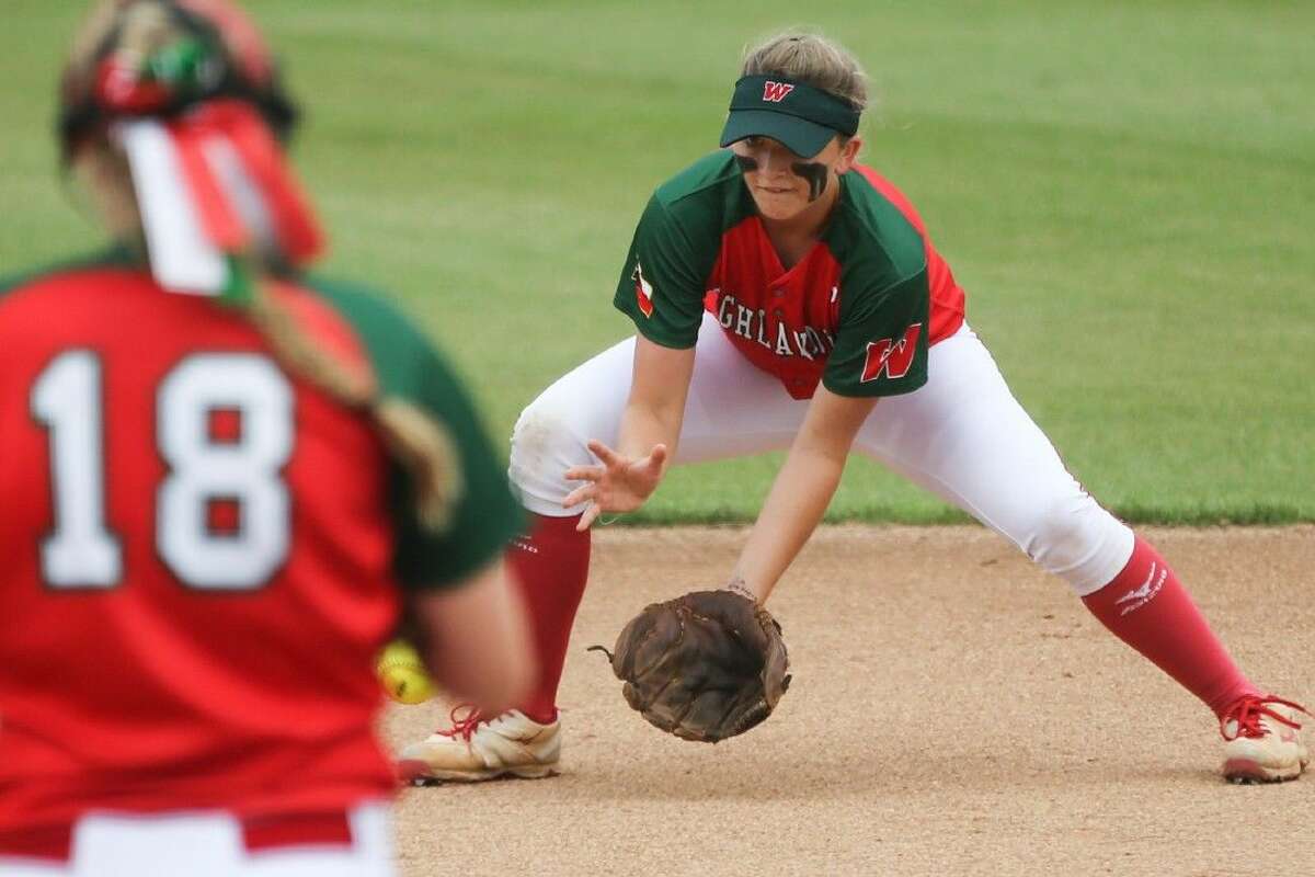 The Woodlands’ Mattison Holt (5) fields the ball during the high school softball game against Klein Oak on Friday at Tomball High School. To view more photos from the game, go to HCNPics.com.