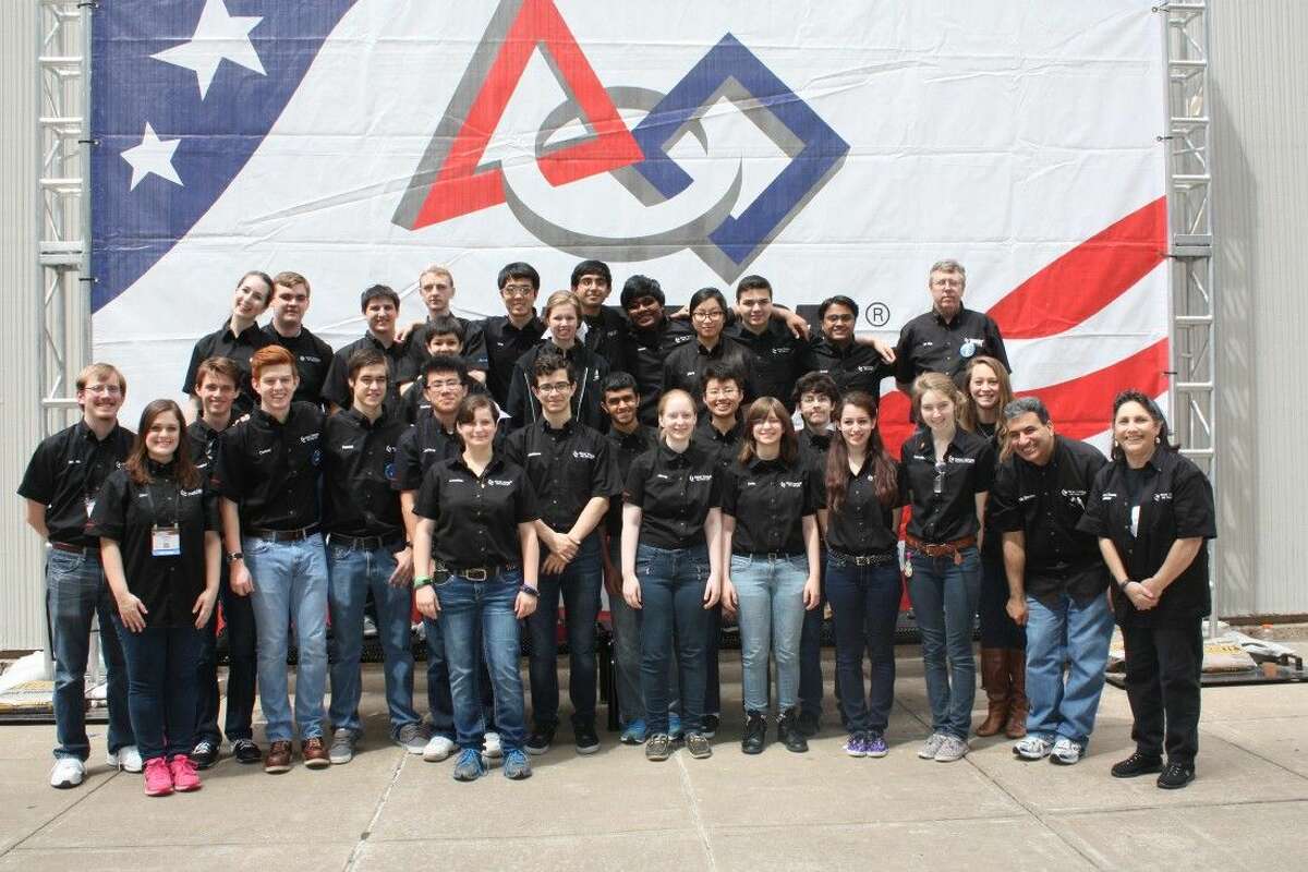 Texas Torque Team 1477 poses at the Edward Jones Dome in St. Louis at the FIRST Robotics World Championship.