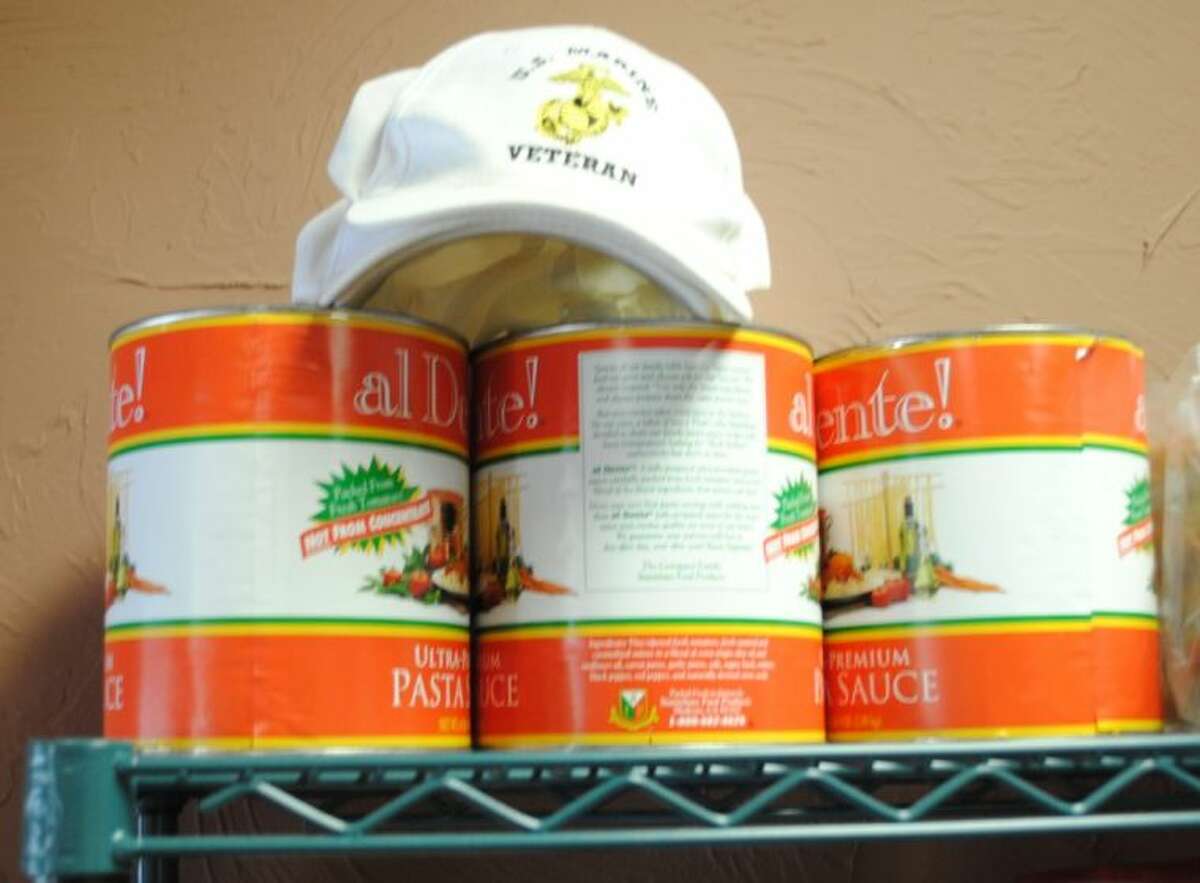 Tony Nicoletta, once a Marine, always a Marine, sets his Marine Veteran cap on the top shelf with the imported pasta sauce.