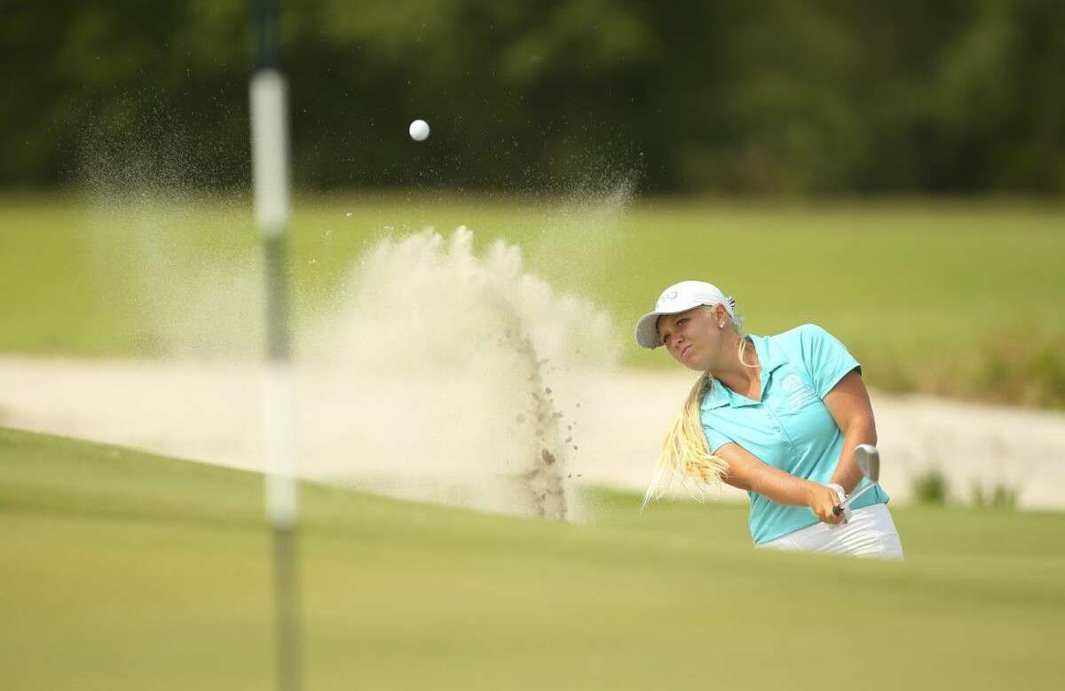 Hailee Cooper hits her third shot on the 14th hole during final round of match play of the 2016 U.S. Women’s Amateur Four-Ball at Streamsong Resort.