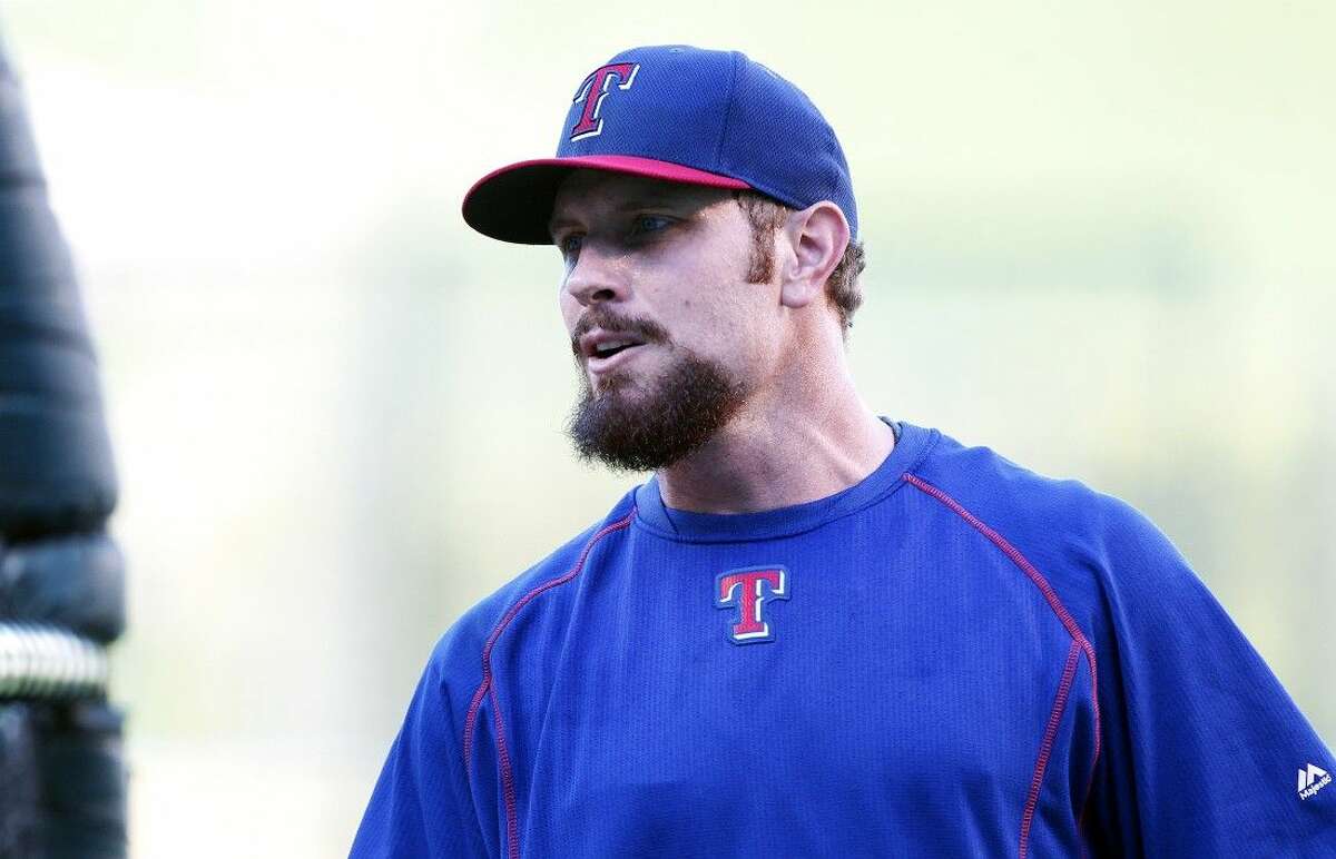 Texas Rangers’ Josh Hamilton talks with teammates during warm-ups before a game against the Los Angeles Angels on Friday.