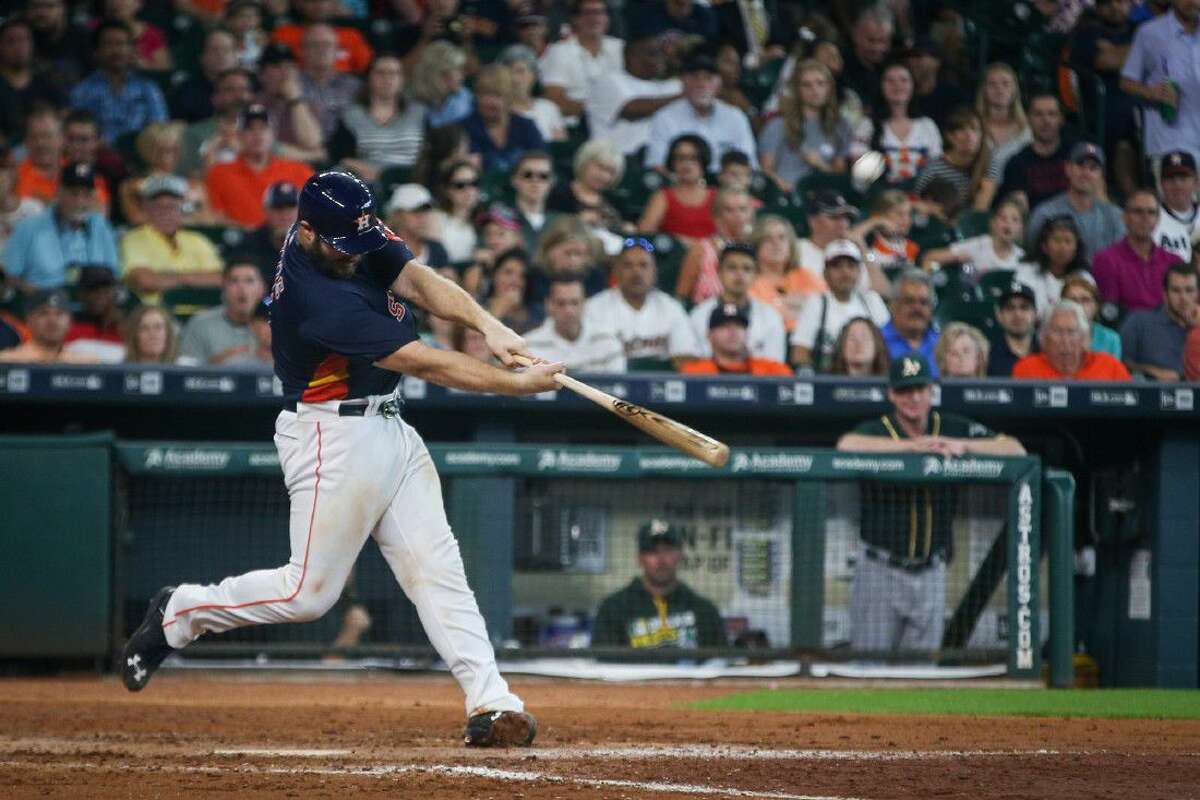 Catcher Evan Gattis, of the Houston Astros, hits a home run during the Major League Baseball game against the Oakland Athletics on Sunday, June 5, 2016, at Minute Maid Park. To view more photos from the game, go to HCNPics.com.