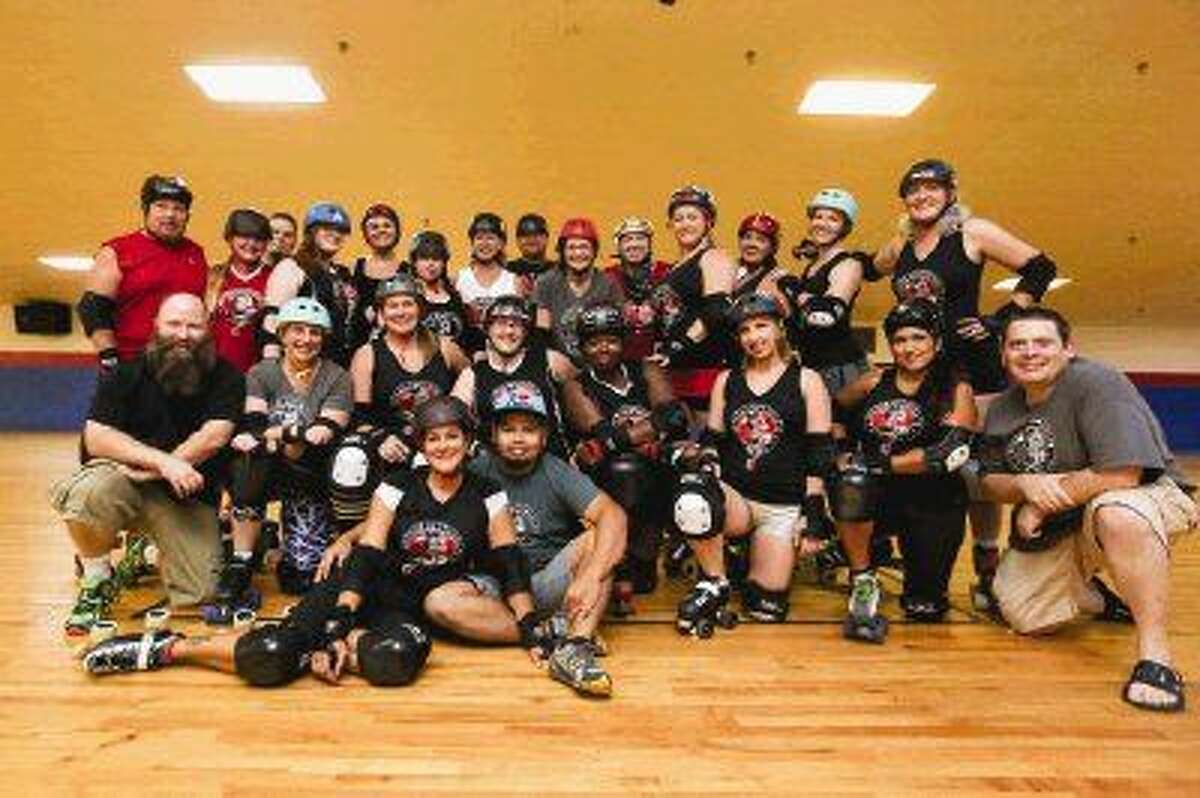 The Conroe Roller Derby poses for a portrait during the team's practice on July 26 at the Rainbow Roller Rink. The team has a bout tonight at Rainbow Roller Rink. Doors open at 5:30 p.m.