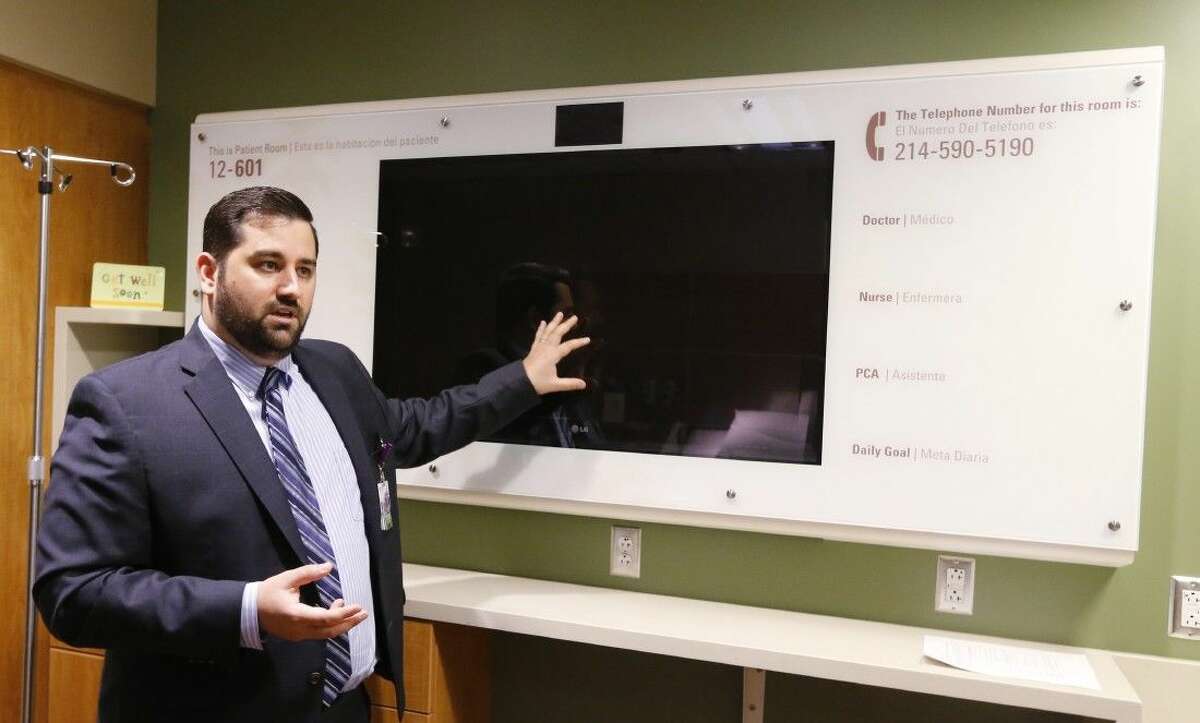 John Longo, Information Technology for New Parkland Hospital explains how the Interactive Digital TV and camera works in a digital patient's room at the new Parkland Memorial Hospital on July 2, 2014 in Dallas. The new Parkland Memorial Hospital is more than a sleek mass of glass and steel, towering 17 stories above Harry Hines Boulevard. Dallas County’s new 1.3 billion public hospital is one of the first “digital hospitals” in the United States. The new campus is teeming with technology that wasn’t even envisioned when planning for the hospital began in 2002.