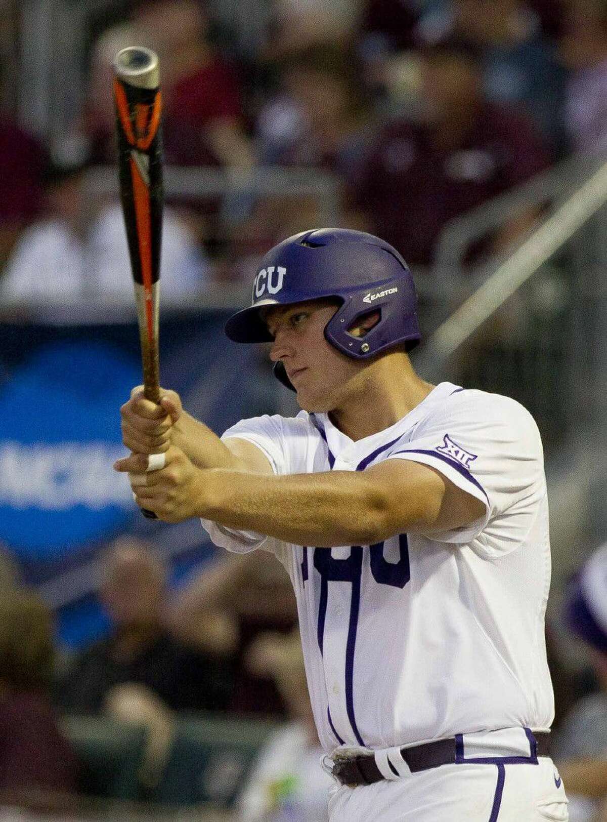 Oak Ridge grad and TCU designated hitter Luken Baker warms up during the second inning of an NCAA Super Regional game against Texas A&M on Saturday night.