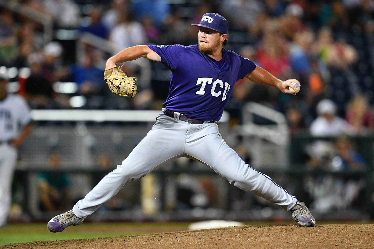 TCU reliever Ryan Burnett (17) pitches against Coastal Carolina in the College World Series on Tuesday evening in Omaha.