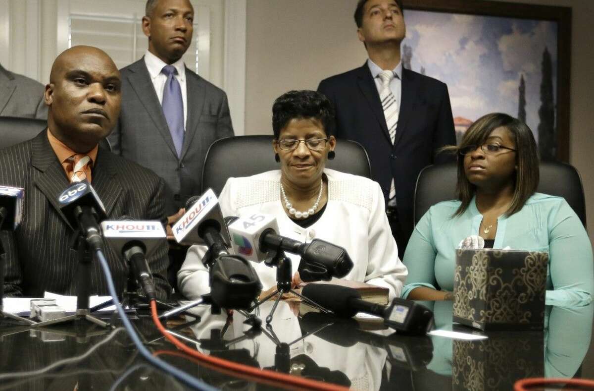 Attorney Cannon Lambert, left, along with Sandra Bland's mother, Geneva Reed-Veal, center, and sister Sierra Cole hold a news conference recently in Houston.