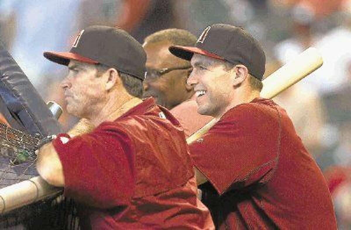 Arizona Diamondbacks first baseman Paul Goldschmidt, who played a key role in The Woodlands’ state championship season in 2006, laughs with a teammate during batting practice.