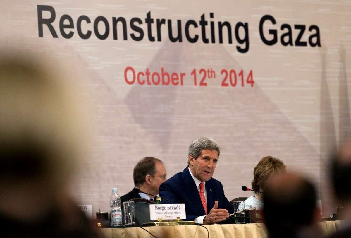 U. S. Secretary of State John Kerry speaks in Cairo, Egypt, Sunday, Oct. 12, 2014, during the Gaza Donor Conference.