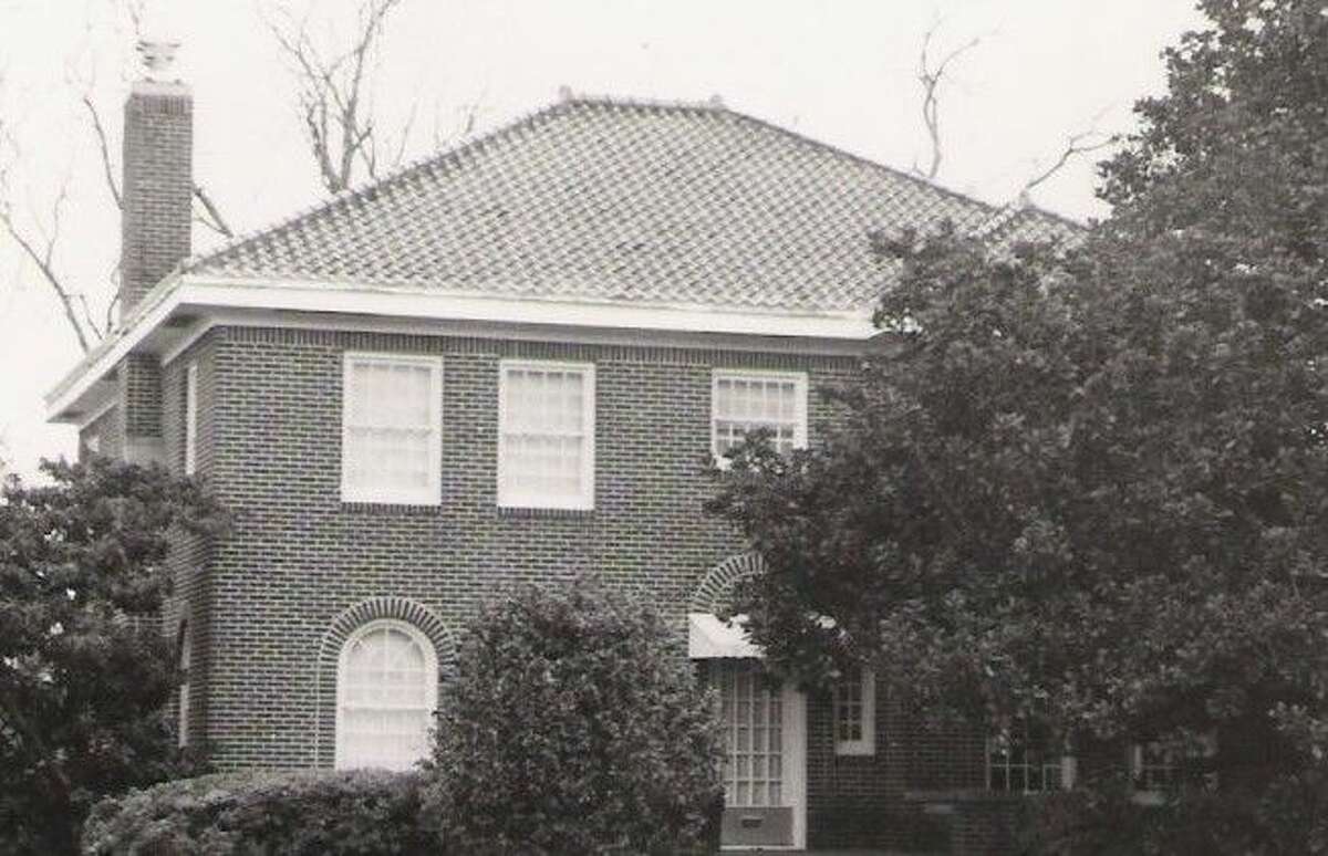 An older photo of the Dr. Falvey home in Conroe. “It was a big, elegant, four-bedroom house on the main street of Conroe at the time with large rooms,” said Olive Davis, daughter of Dr. Falvey, who grew up in the house. “Whenever something big happened in Conroe, like a parade, it always went right past our house.”