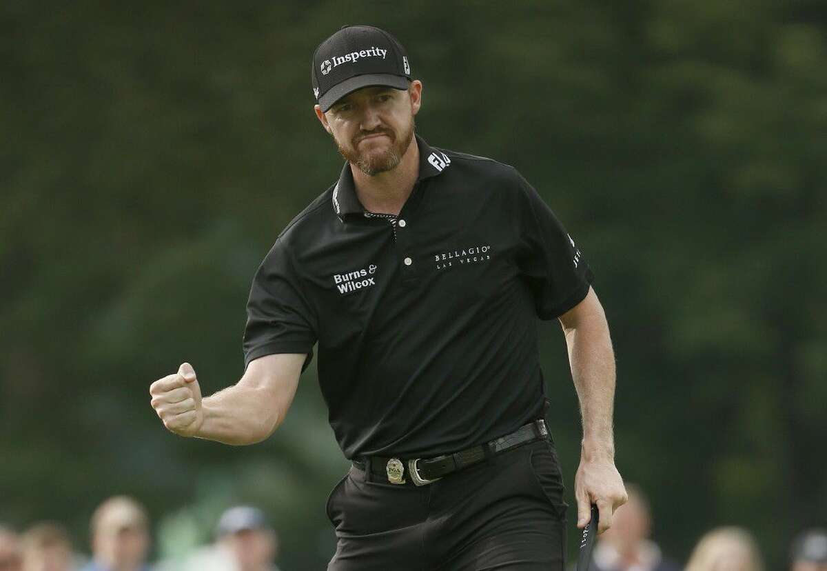 Jimmy Walker reacts to his birdie putt on the 11th hole during the final round of the PGA Championship golf tournament at Baltusrol Golf Club in Springfield, N.J., Sunday, July 31, 2016.