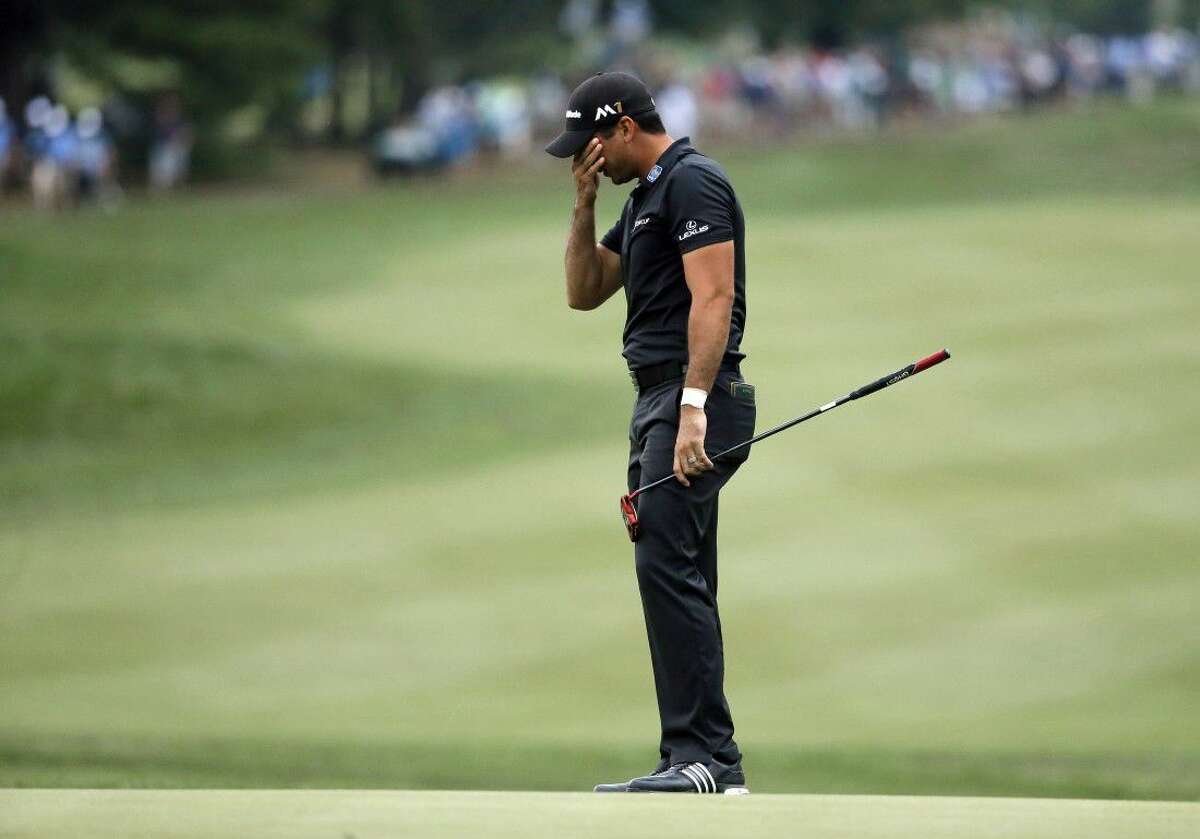 Jason Day reacts after missing a birdie putt on the 14th hole during the final round of the PGA Championship golf tournament at Baltusrol Golf Club in Springfield, N.J., Sunday, July 31, 2016.