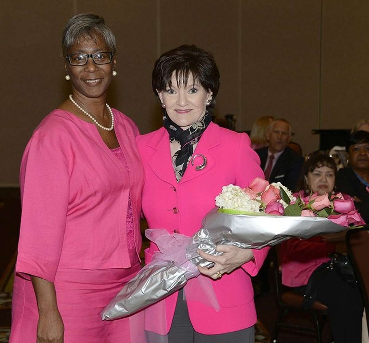 Featured speaker Beth Sanders Moore, left, and breast cancer survivor Bettye Washington, a Harris Health System employee, attend the Harris Health System Breast Cancer Survivors Luncheon on Oct. 4 at the Bayou City Event Center.