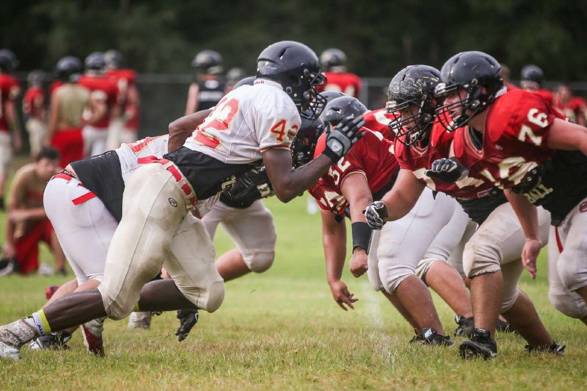 Caney Creek linemen block during football practice on Friday at Caney Creek High School.