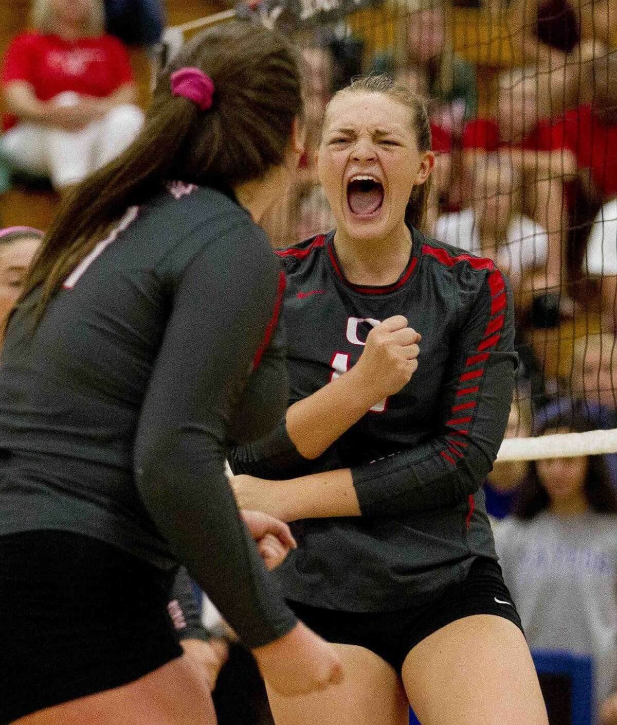 Oak Ridge's Hailey Lohnes celebrates a point in the first set of a gold bracket semifinal volleyball match during the Katy/Cy-Fair Nike Invitational. Go to HCNpics.com to purchase this photo and others like it.