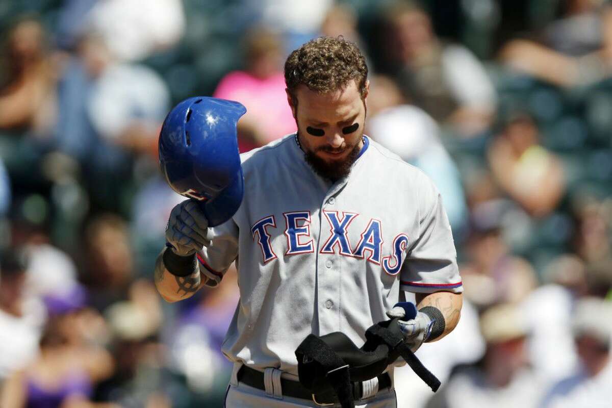 Texas Rangers’ Josh Hamilton reacts after striking out against the Colorado Rockies last season in Denver.