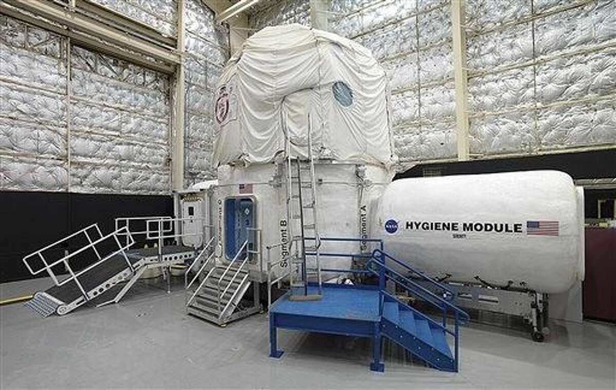 The space agency, which is contemplating a future journey to Mars, is working with a military laboratory at the submarine base in Groton, Conn., to measure how teams handle stress during month-long simulations of space flight.