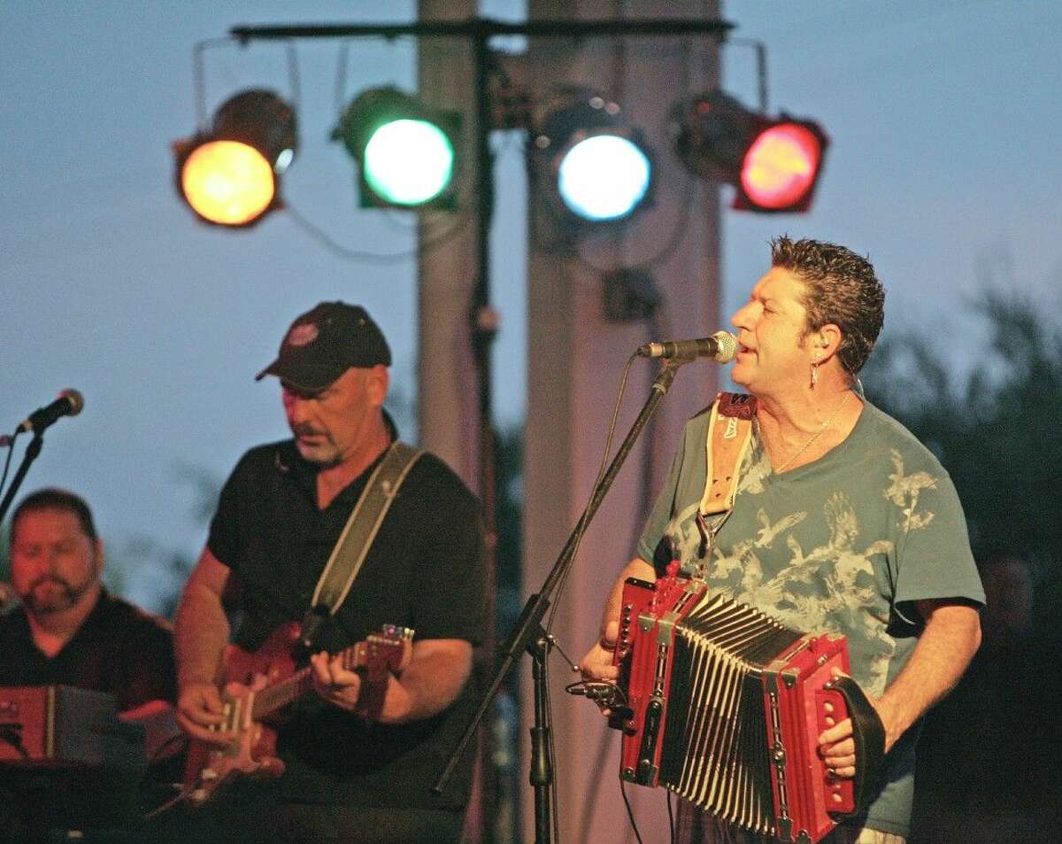 Wayne Toups, right, performed at a First Thursday Free Concert at Heritage Park in downtown Conroe. A favorite of the festival, Toups returns to Conroe on the Cajun Stage Friday night from 10:30 to midnight.