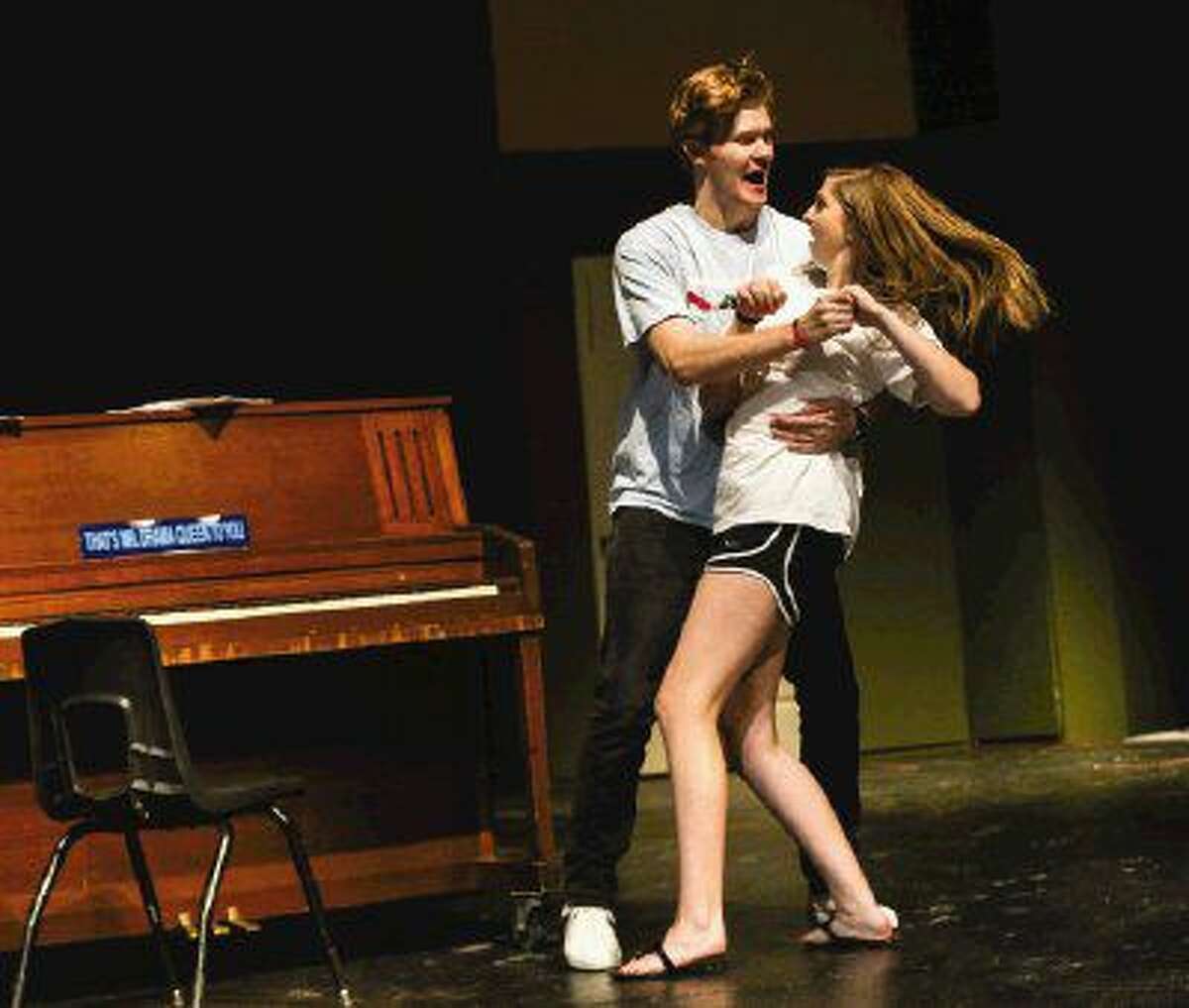 The Woodlands senior Chance Bryant dances with junior Lauren Witt during a rehearsal for "The Musical Comedy Murders of 1940" at The Woodlands High School.