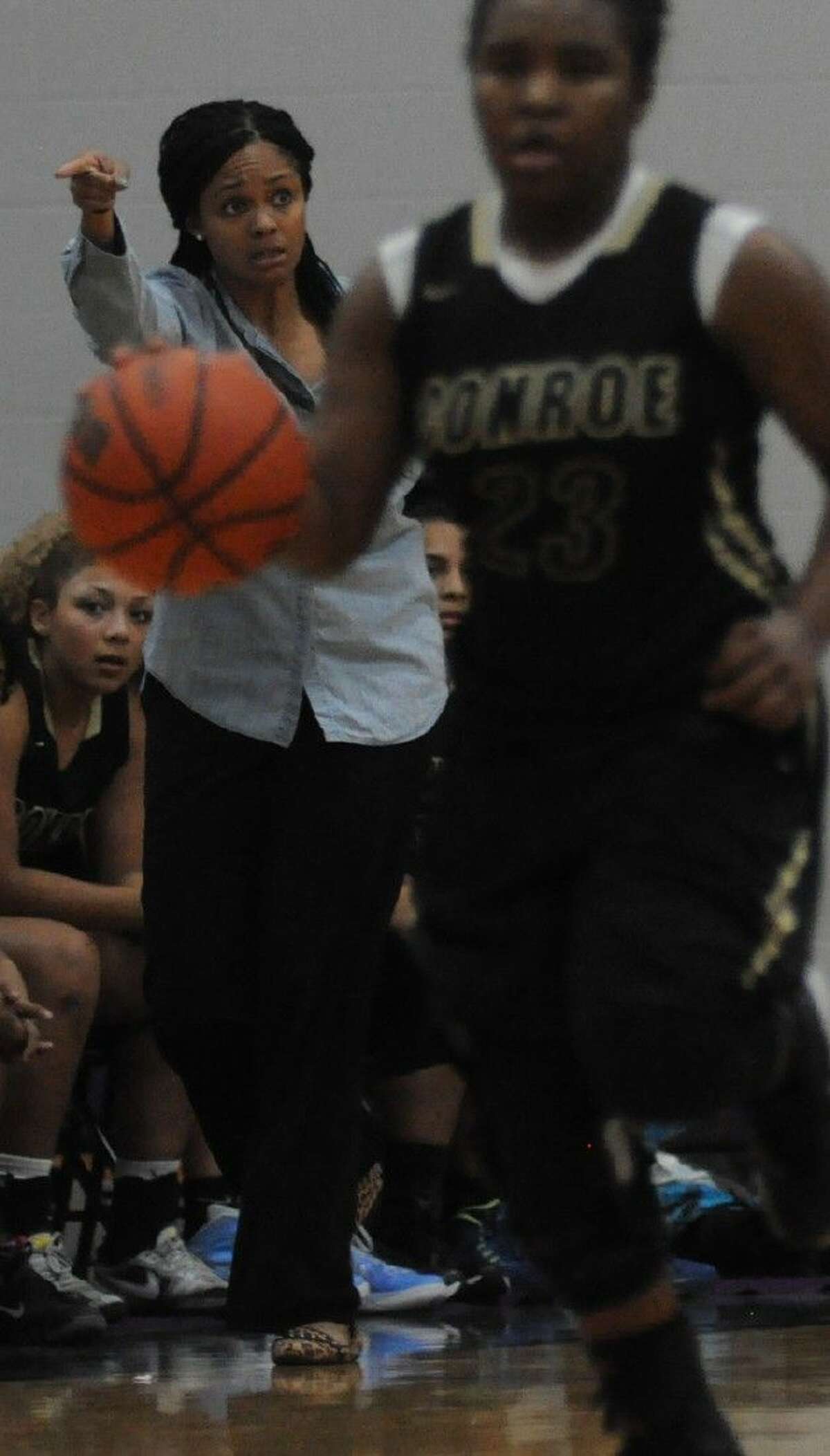 Conroe coach Tamisha Houston directs her team against Willis on Tuesday at Willis High School.