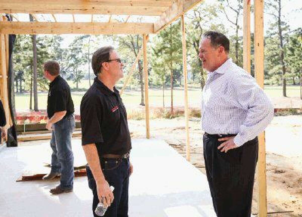 Ted Cummins, Chief Creative Officer at Morning Star Builders, left, speaks with Bruce Hillegeist, President of the Greater Tomball Area Chamber of Commerce, during the groundbreaking ceremony on Monday at Bluejack National Golf Course in Montgomery.