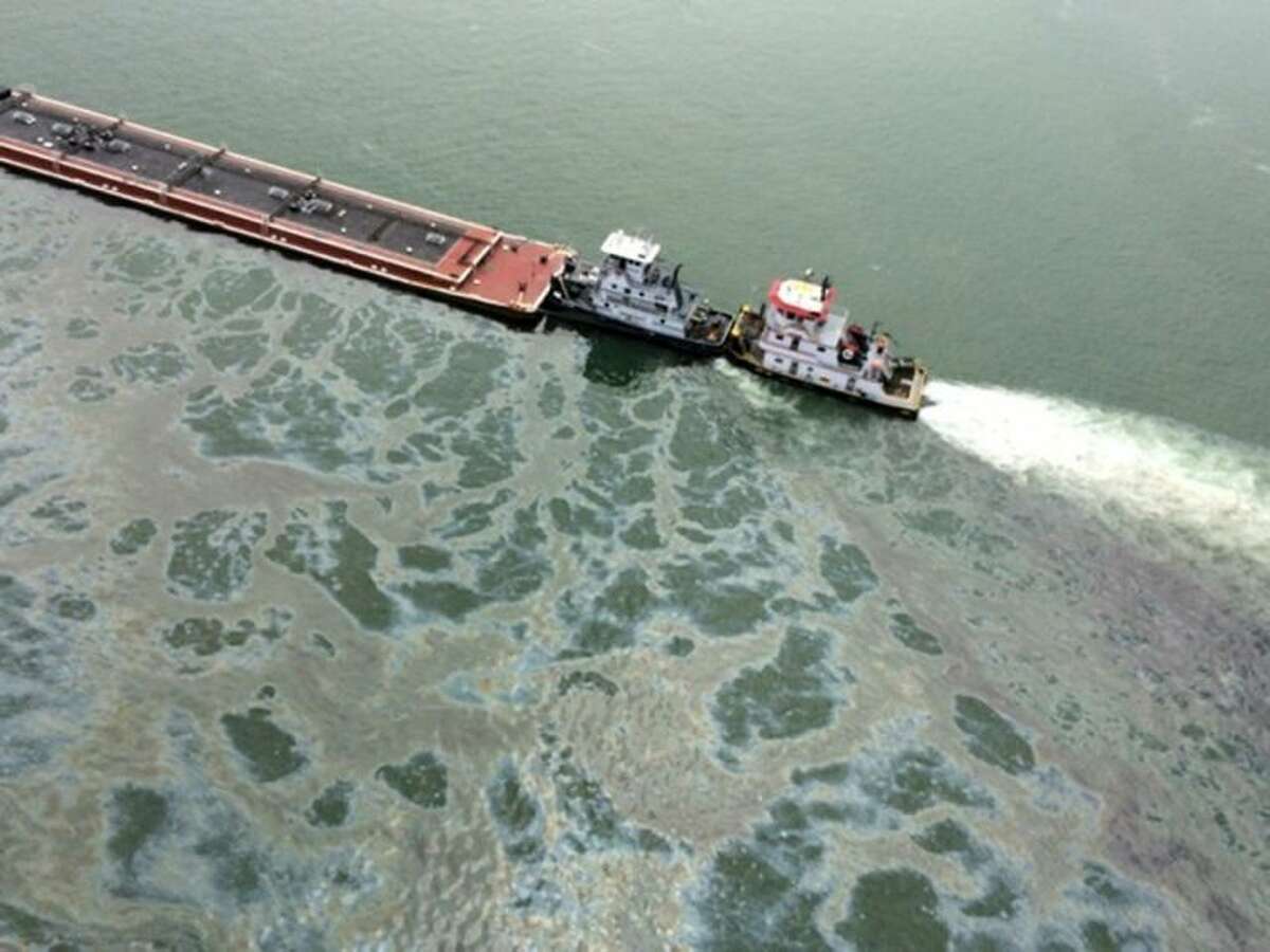 A barge loaded with marine fuel oil sits partially submerged in the Houston Ship Channel, March 22, 2014. The bulk carrier Summer Wind, reported a collision between the Summer Wind and the barge, containing 924,000 gallons of fuel oil. The barge collided with a ship in Galveston Bay on Saturday, leaking an unknown amount of the fuel into the popular bird habitat as the peak of the migratory shorebird season was approaching.