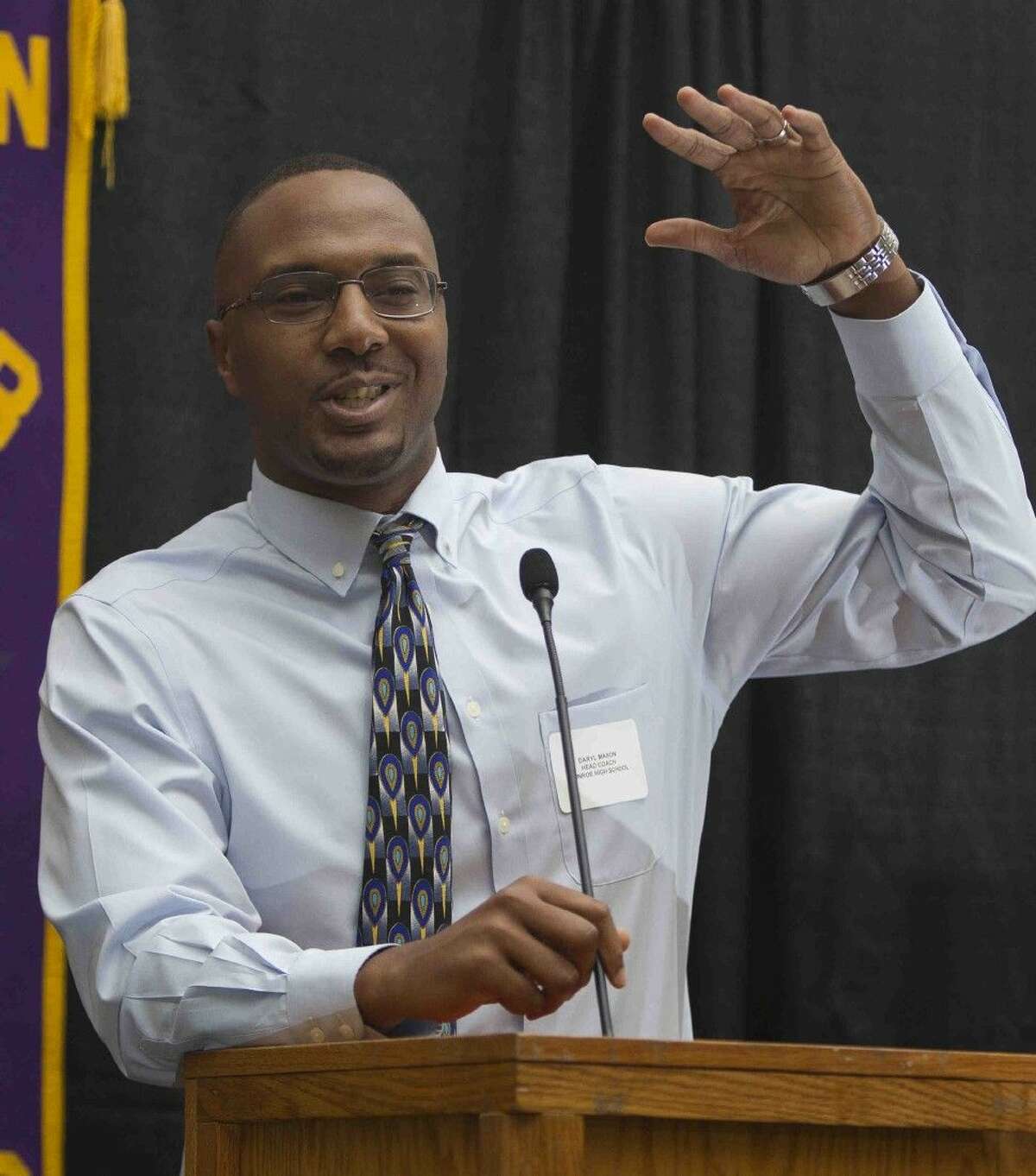 Conroe coach Daryl Mason speaks about the upcoming basketball season at the Conroe Noon Lions Club meeting Wednesday.