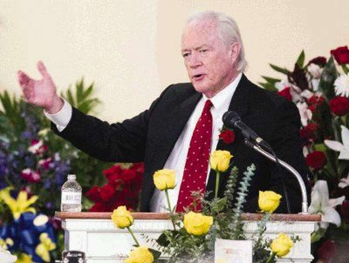 Former Montgomery County Judge Alan B. Sadler talks about his childhood friend and former City Council member and mayor pro tem John Ross Martin III at Metcalf Funeral Home Friday in Conroe.