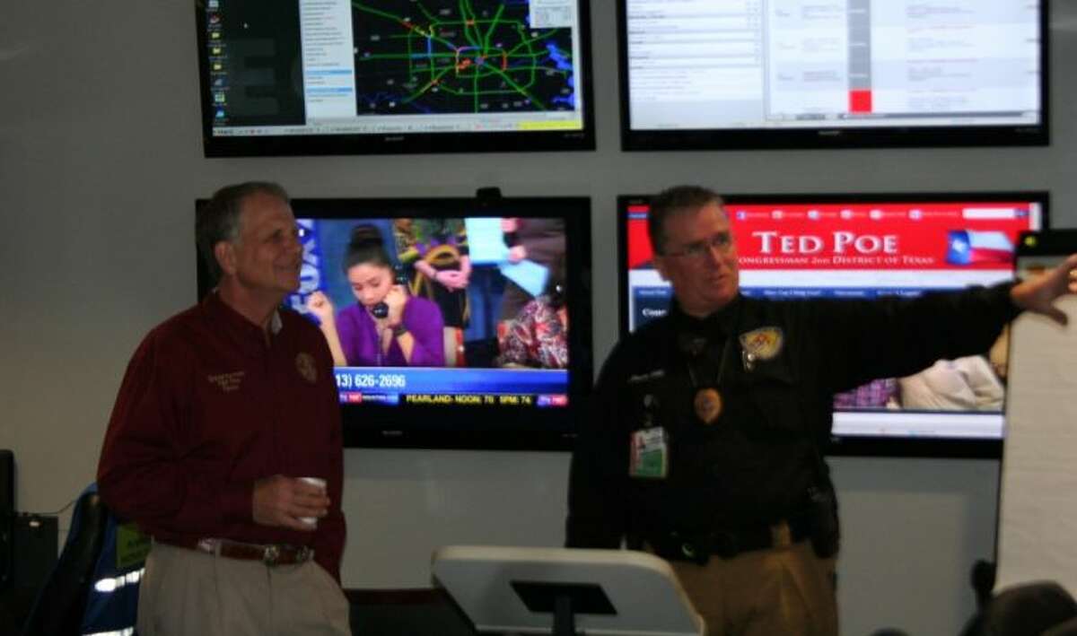 Shannon Sharp with Humble ISD police shows U.S. Rep. Ted Poe Humble ISD's Emergency Operations Center.