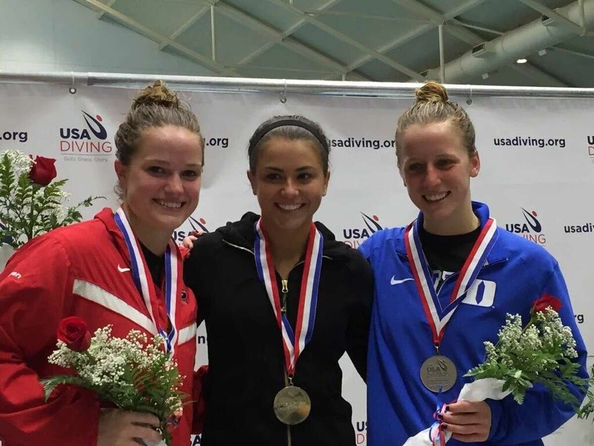 Kassidy Cook, center, a graduate of The Woodlands High School, won the women’s 3-meter springboard final with a total score of 975.20 at the USA Diving Winter National Championships in Indianapolis.