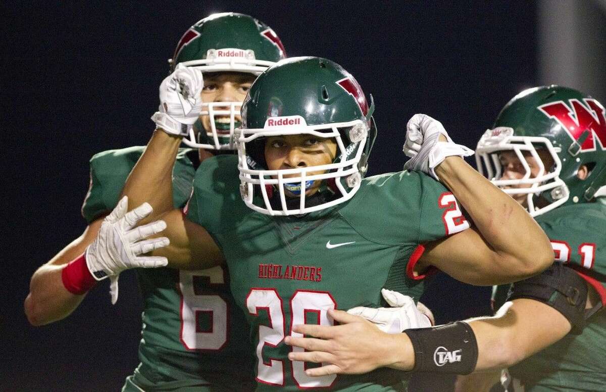 The Woodlands’ Antoine Winfield Jr. (20) celebrates with teammates after scoring a touchdown against La Porte. Winfield is The Courier’s choice for Montgomery County Player of the Year.