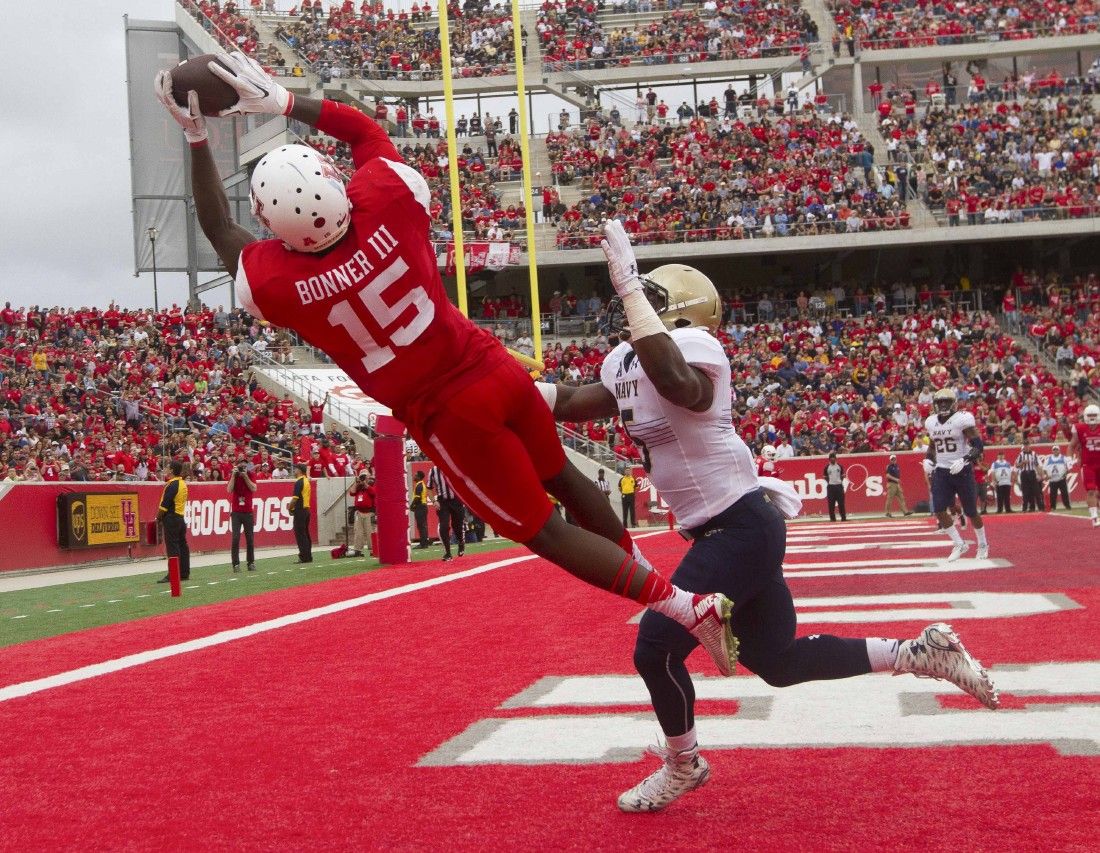 COLLEGE FOOTBALL: Ward leads No. 21 Houston to 52-31 win over No. 16 Navy