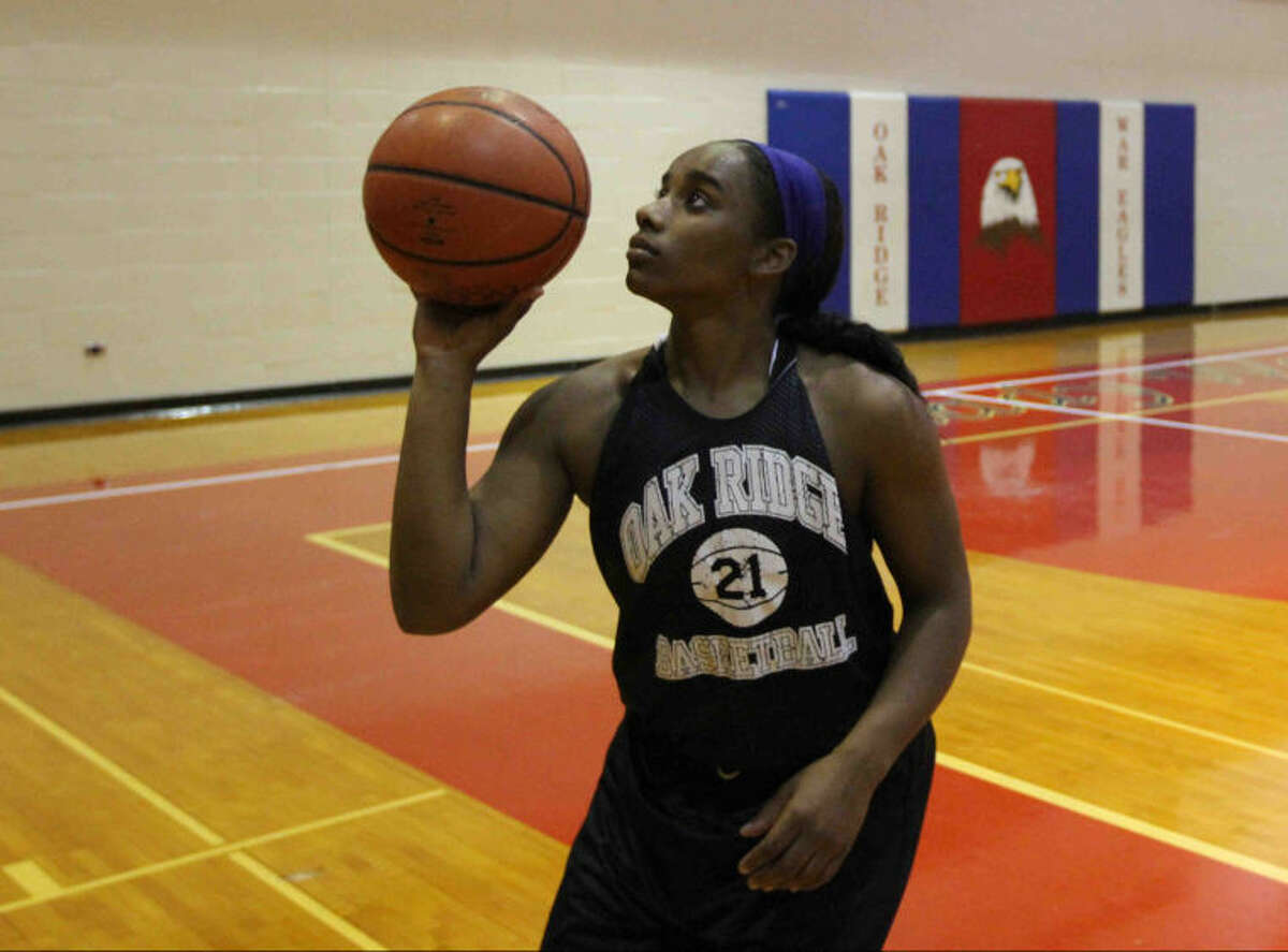 Raquel Kellow practices her shot during basketball practice at Oak Ridge High School.