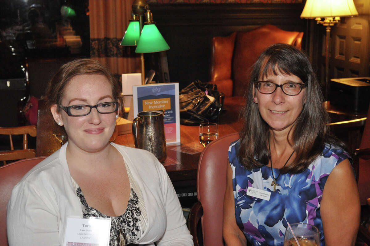 Legal Aid Staff Tara Sentz and Patricia Ranney at the welcome table.