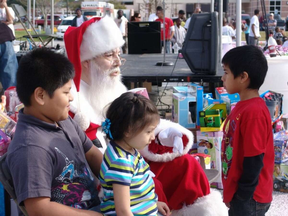 Santa Claus was available for last minute gift suggestions from kids who arrived for the bike giveaway on Friendswood Drive.