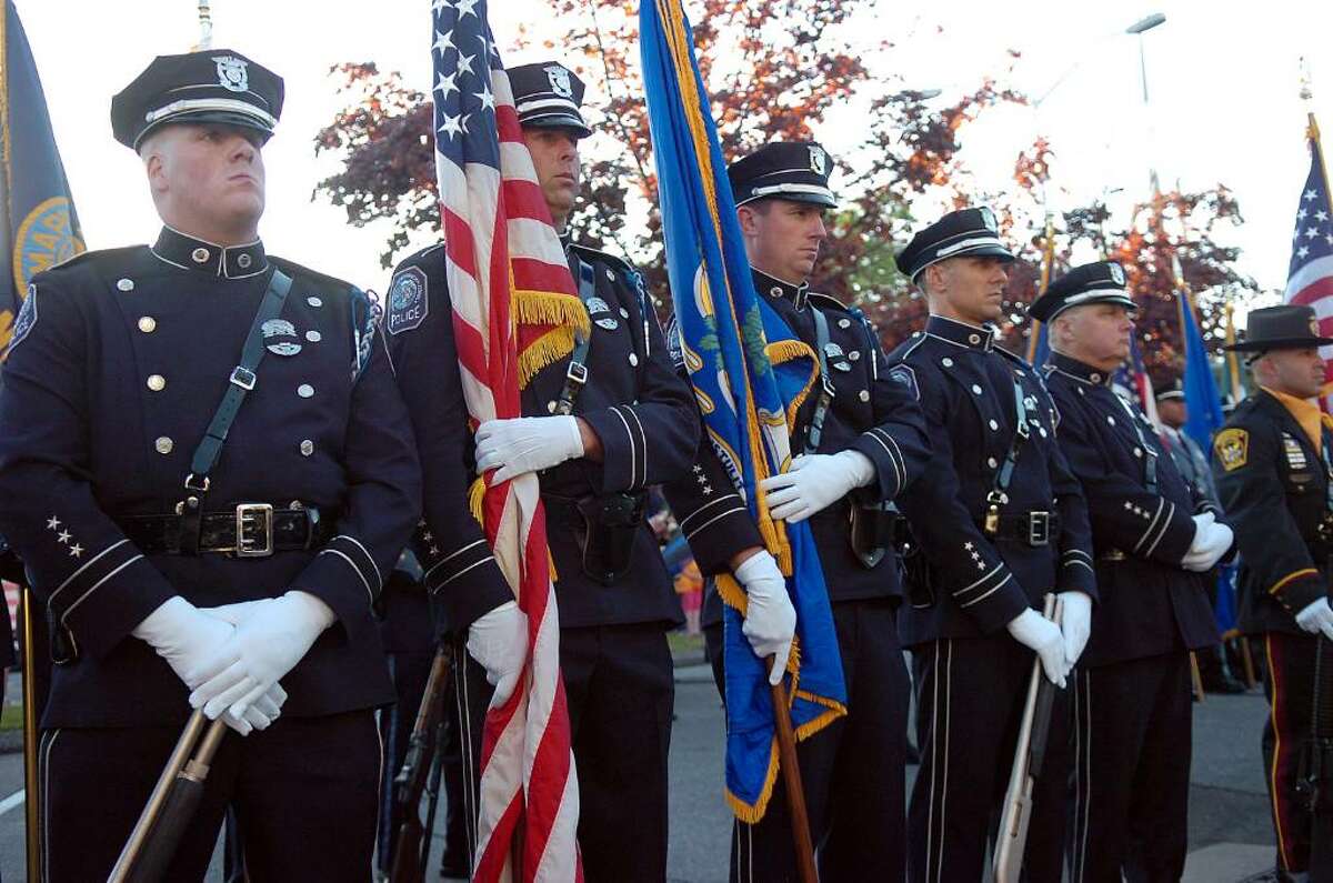 Stamford police parade turns streets blue and red