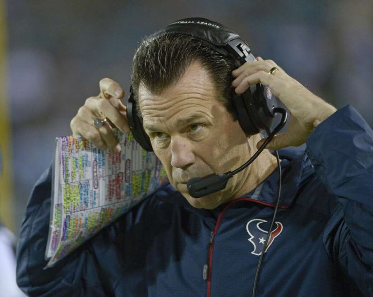 Houston Texans coach Gary Kubiak adjusts his headset as he watches his team against the Jacksonville Jaguars on Thursday in Jacksonville, Fla. The Texans fired Kubiak on Friday, parting ways with the only coach to lead the team to the playoffs.