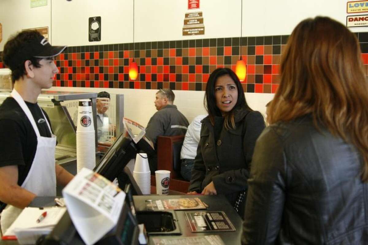 Marisol Pina was surprised at Jimmy John’s in Humble by Third Coast Bank employees who are surprising customers by purchasing their meals through their holiday Random Acts of Kindness program.